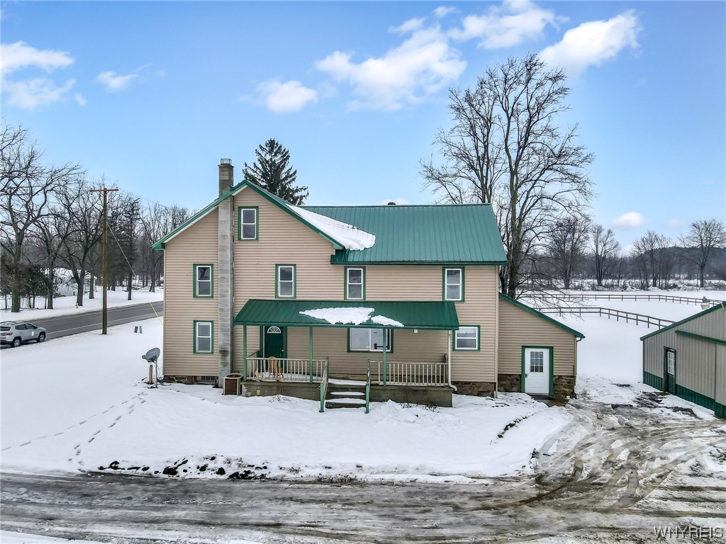 Looking for a large home with land and barns?  Here it is!  This home is over 2400sq ft with very large rooms.  4 huge bedrooms with a possible 5th, 2 full baths, large kitchen with pantry, and 2 lovely porches to overlook 3.5 acres.  Updates include h/w brand new '24, furnace '21, 200 amp electric '15.  House has a 4 yr old metal roof, public water, wood stove in basement to off-set heat costs, closets aplenty, 2 staircases, full attic and more.  Out back you will find a 24x40 pole barn and a 33x40 pole barn both with metal rooves within 10 years.  There is a horse stall, and electric in barn.  No delayed negotiations!