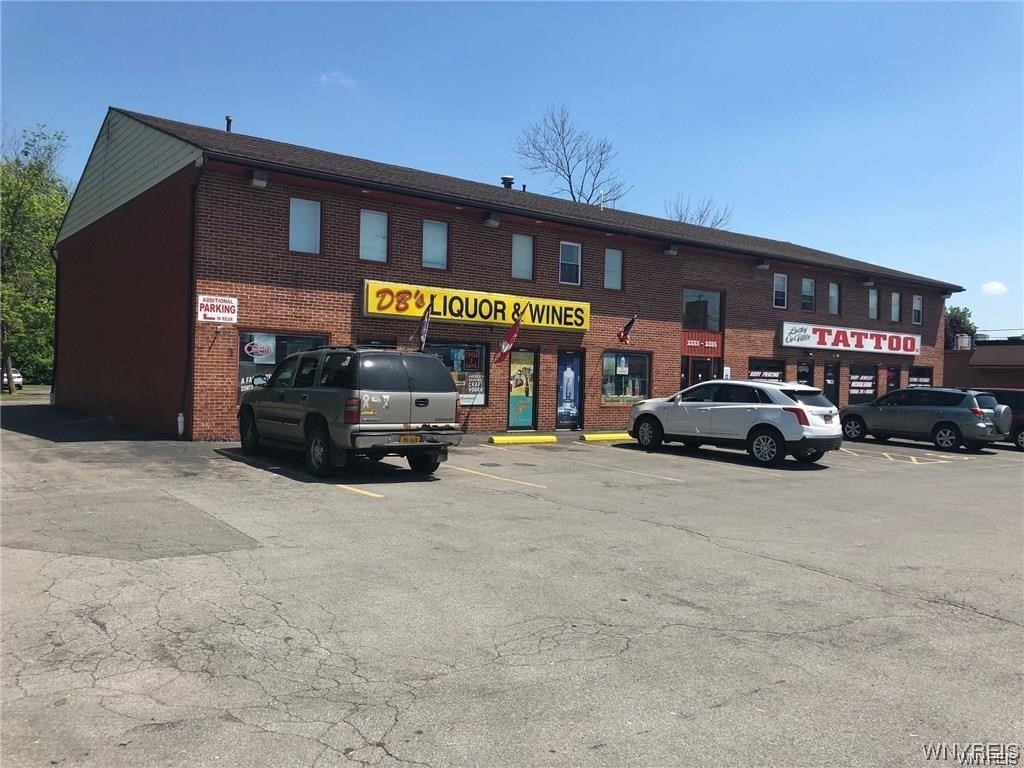 LOCATION LOCATION LOCATION (just north of the Youngman Expressway/I-290 Niagara Falls Boulevard Exit & is as good as it gets. ) Commerciao building for sale, 10,000 SF total. Building in great condition. h Solid Brick & Mortar Construction with First Floor Retail (with strong tenants), and 2nd Floor Office Space & Storage. Elevator, updated HVAC, Good Roof, Separate Electric meters. Accessibility is one of the prime features of 2335 Niagara Falls Blvd, with the I-290 and I-990 Expressways just moments away. Property is just north of the Youngman Expressway/I-290 Niagara Falls Boulevard Exit. The site also features free on-site parking for customer and employee use, 50 car spots. S U P E R B LOCATION TRULY IS AS GOOD AS IT GETS.  RENT ROLL ATTACHED along with RENTED PROPERTY RIDER & OTHER FINANCIAL PARTICULARS are also available on request. DRONE VIDEO COMING SOON TOO!