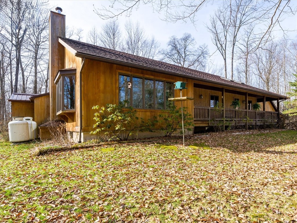 Welcome to the Lake. Secluded cedar sided ranch home on a 2 acre wooded lot complete with Coy pond and wrap around deck!  Large 2 car garage, shed, Gazebo, wisteria covered pergola. Enjoy your morning coffee overlooking the woods in the glass enclosed heated Sun room! Take a short stroll to the lake Ontario shoreline. Deeded 66' shared Right of way to Lake Ontario at the end of Iroquois Dr. & Oak Orchard on the Lake. Paradise Found!
