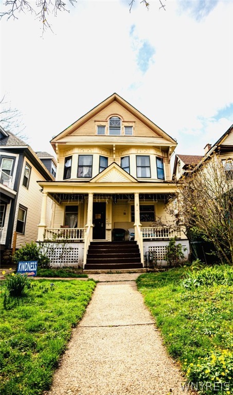 In the heart of Elmwood Village, this spectacular 1901 grand Victorian home is where the ornate charm of the historic—meets the modern updates of the here and now. A House Full of Possibilities! Offering 1ST FLOOR IN-LAW STUDIO w/ separate entrance, bathroom, washer/dryer, half-kitchen, French doors leading to private deck… 2ND FLOOR w/ FIVE SIZABLE BEDROOMS… 3RD FLOOR PRIVATE LIVING SPACE w/ kitchen, bedroom, living room, bathroom. Driveway w/ 1-car garage: a coveted feature in this Elmwood hotspot! Be greeted by a towering stained glass original masterpiece. Hardwood floors, pocket doors, ornate woodwork exude the elegance of historic craftsmanship. Spacious sitting-living room offers versatility: 1 or 2 rooms. Wood fireplace, elegant dining room, updated kitchen. Renovated front porch, fenced-in backyard. List of updates available, incl. new water line, floating sewer, reinstallation of historic brick driveway, electrical improvements, energy efficient Anderson windows and much more. Pick your vision: An in-law apartment... Long-term rentals... Vacation rentals…Private living space! Step into your future of possibilities in this beautiful and convenient Elmwood Village jewel.