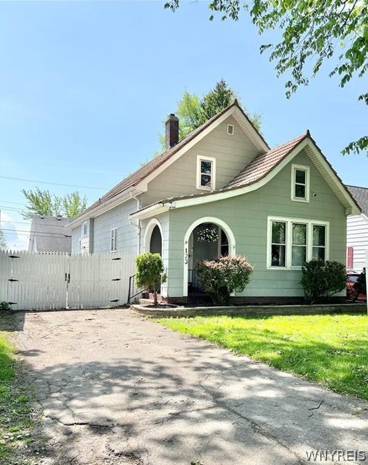 Here’s your chance at this charming Cape Cod home on a sought-after, tree-lined street in South Buffalo! It is conveniently located within walking distance to city amenities, such as restaurants, schools, grocery stores and two Olmstead parks. This character-filled home features a quaint front porch, a spacious living room with a stately gas fireplace, a large dining room through a beautiful archway and a generous galley kitchen with ample storage. Newly remodeled downstairs bathroom with bathtub, and two bedrooms on the main level. Sizable primary bedroom upstairs with an additional bedroom and full bathroom boasting a stand-up shower. Gorgeous woodwork and hardwood floors throughout, the home also offers a full basement for storage and laundry, a fully fenced yard with a shed and a private driveway. Welcome home!