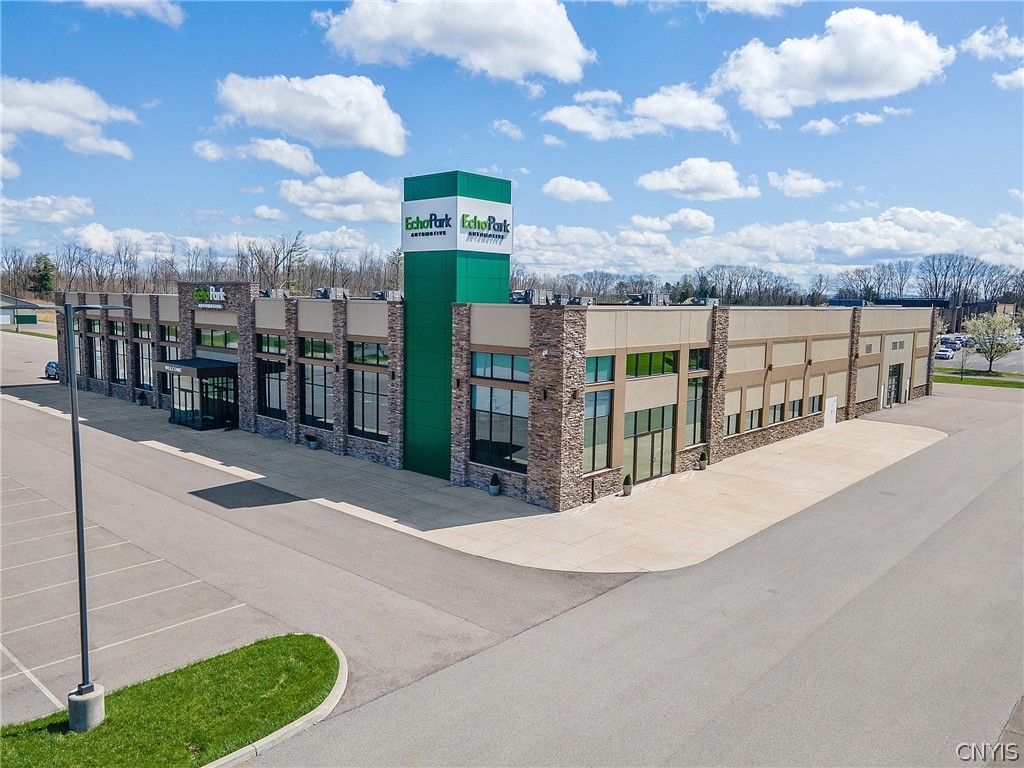 It's difficult to find an all-in-one property ready to suit the needs of a business or corporation more than this fantastic commercial property at 8010 Brewerton! With 10.69 Acres of included land, a 42,698 SqFt main building and a 9,280 SqFt second building, 8010 Brewerton already has the space and infrastructure to support an exciting new or established business in this community! 620 parking spaces within the property, wash bays within the second building, showroom space, a sizeable kitchen,cafeteria, breakrooms, offices, 7 bathrooms and conference rooms are just a handful of the features that this property has to offer. The exterior groundwork was completed in 2017 meaning the real property is still less than a decade old. Retail chains, automotive or farm equipment dealers, government officials, law enforcement departments and many others types of businesses or entities would be able to make this location home; especially if they're looking to expand or have outgrown their previous location. City Utilities, Central HVAC and Oil heating are installed to power and direct to all of the offices and work spaces. Come see if 8010 Brewerton is what your team has been looking for!