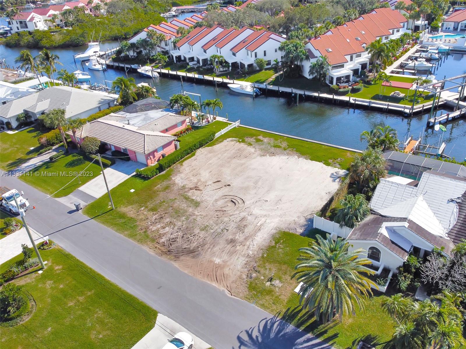 Build your dream home on this unique deep water homesite. 155 ft deep x 91ft wide on the water, situated just a few lots from the intracoastal waterway. NO HOA. No Fixed bridge. Sea wall in good shape. This lot is located on the south side of Edward Rd where the inlet is deep and well maintained and can easily accommodate a large boat. Many homes have already been newly built in this street. New sewer lines were just installed along the street for an easy tie in. Just south of Donald Ross and a short ride to the beach.
