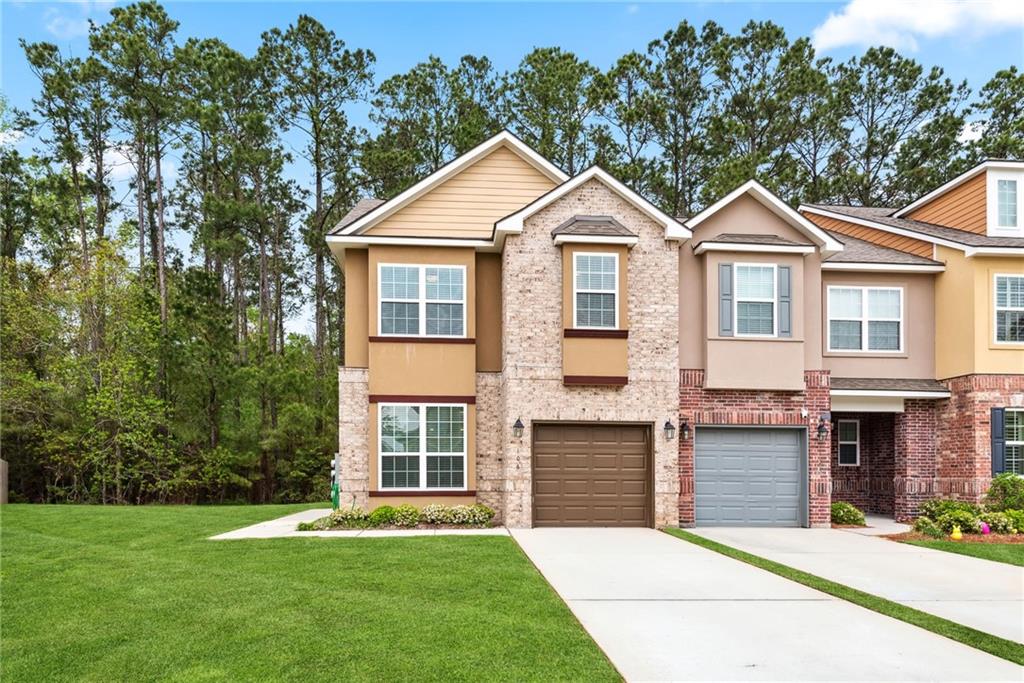 This immaculate townhome in The Village at Guste Island offers a like-new living experience. Boasting 3 bedrooms, 2.5 bathrooms, a spacious living room, and a separate den, this unit exudes comfort and functionality. Upgraded with custom granite counters, cabinets, stainless steel appliances, window blinds, framed bathroom mirrors, and modern lighting, every detail reflects quality and style. Enjoy the convenience of garage/utility room storage and the added benefits of gutters above the patio and a beautiful rear yard. Residents also have access to a community pool, play spaces, clubhouse, and more, fostering a vibrant community atmosphere. With excellent schools nearby and situated in Flood Zone X, this home offers both luxury and peace of mind.