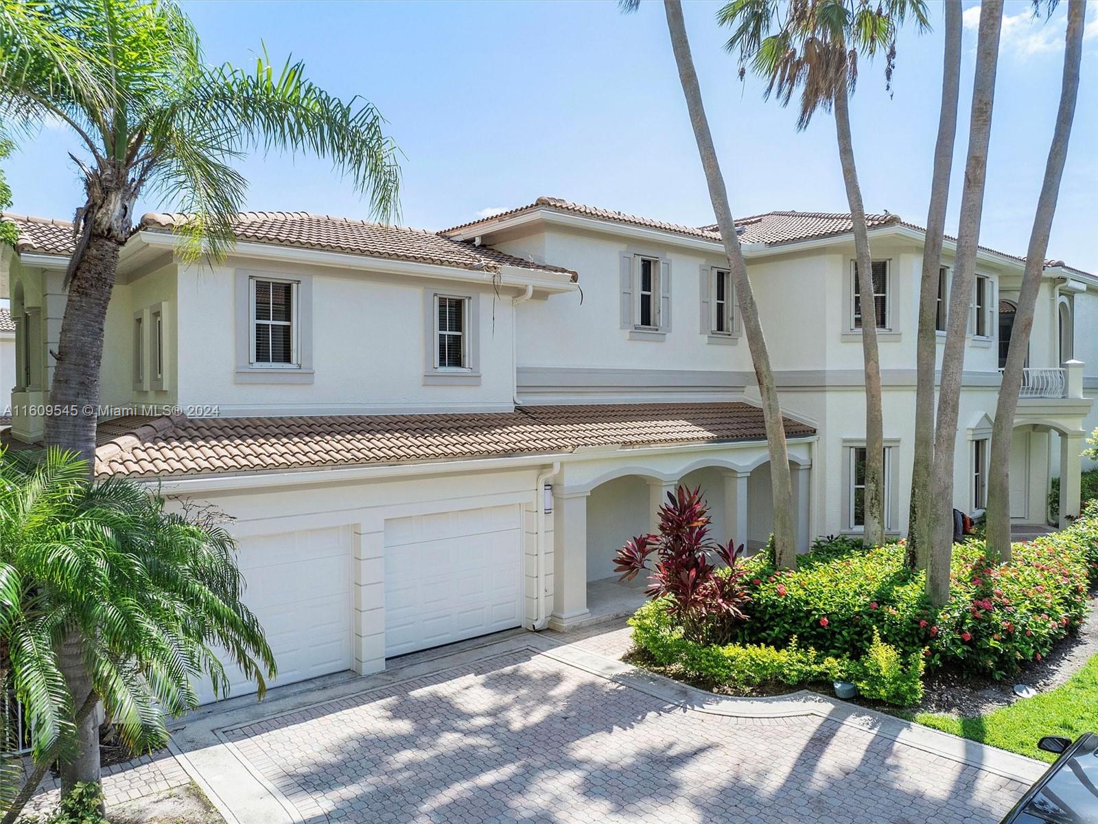 Just beautifully renovated waterfront residence located in The Courtyard Homes at The Point. This home sits right on the Intracoastal Waterway and has a private deeded dock as well as a boat lift. This gorgeous home is light and bright and never lived in since being renovated.  It has 5 bedrooms and 4.5 baths.  The main house has 3 bedrooms and the guest house has 2 bedrooms and 1 bath and it's fully equipped.  The Point offers 5 star amenities including 3 swimming pools and pool service at the main pool, 4 tennis courts, 4 BBQ areas, a world class gym and spa, a playground and a restaurant.  There is 24 hour security and is in close walking distance to houses of worship, shopping and the waterways marina.  CURRENTLY RENTED FOR A YEAR, please only schedule showings WEEKDAYS BEFORE 1:00.