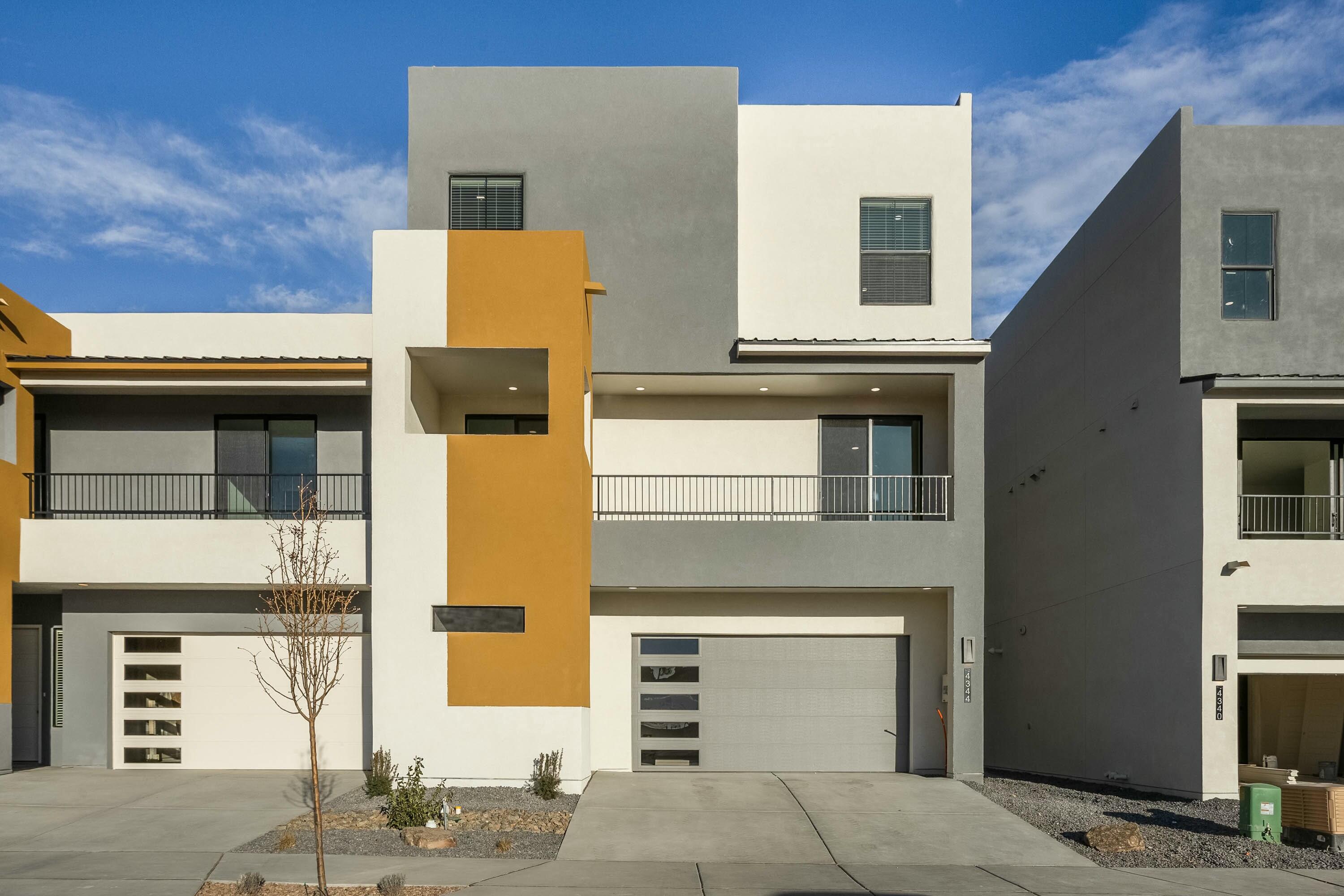 Luxury 5 bedroom Townhome in the NE Heights ready for move in. ! Gated new community on the corner or Montgomery and Wyoming. Beautifully appointed three-story home with the convenience of an elevator and all the lux features you want. Gourmet kitchen w/ 48'' dual fuel oven w/6burners and griddle. Granite, tile, multiple balconies. Plus, super efficient rated NMBuild Green Silver. Convenient to restaurants, services, and shopping. Bdrms are spacious. The primary suite bathroom has a lge, walk-in closet, separate tub and shower, dual vanities, separate commode room. 3rd floor has a 30 x 15 game room and one bdrm both with access to a large, covered balcony. 2-10 Warranty included in addition to a 1-year exclusive Builder's Warranty.