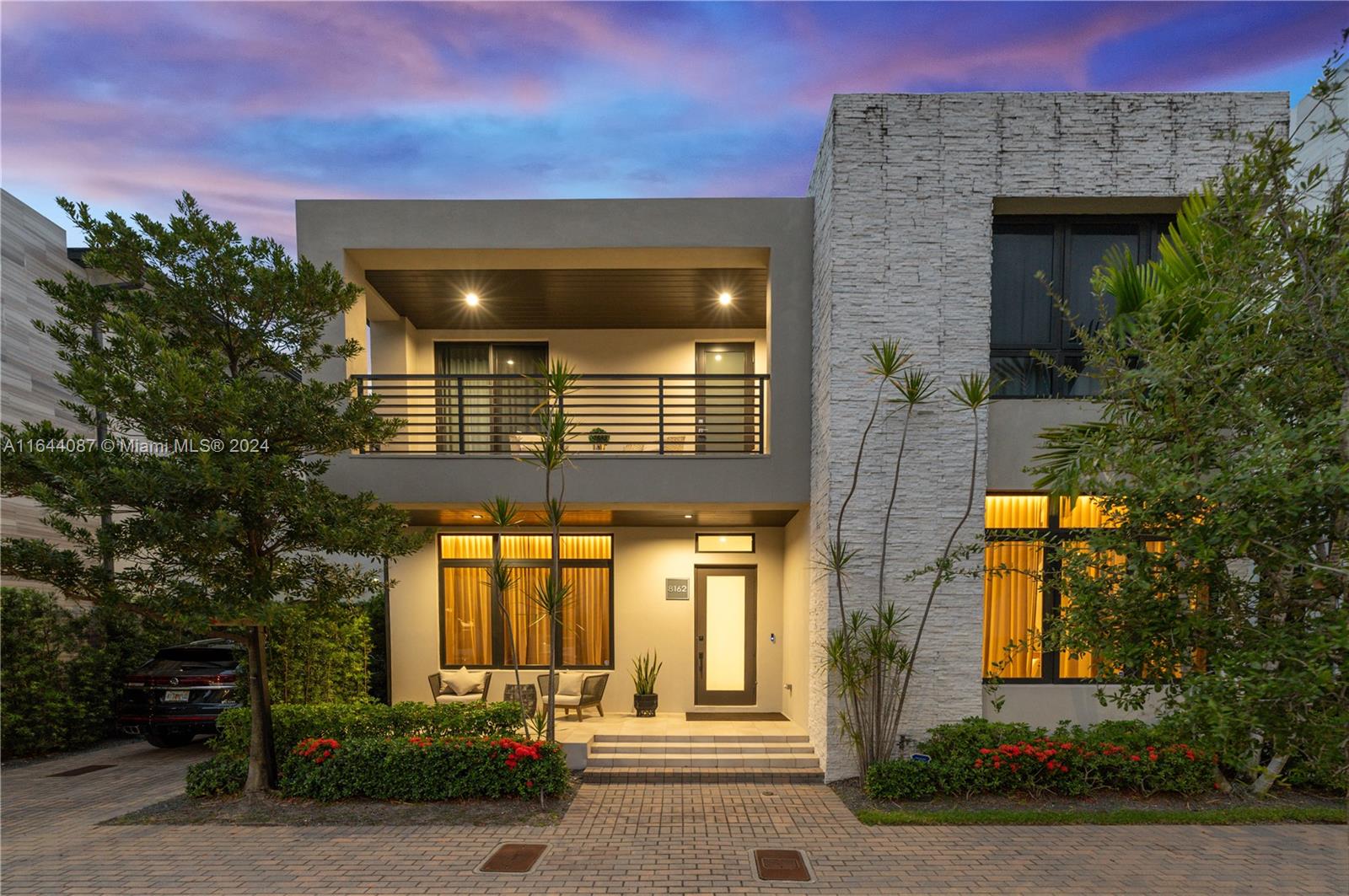 Discover the epitome of modern luxury in this custom-designed single-family home, nestled in the heart of Downtown Doral. From the moment you step inside, you're greeted by soaring ceilings and an expansive open-concept layout adorned with bespoke, contemporary finishes. Every detail, from the chic custom wallpaper to the state-of-the-art LED lighting, has been meticulously curated. This home boasts cutting-edge smart technology, a double car garage, and a stunning pool. The primary suite is a sanctuary with a private outdoor terrace, a spa-inspired bathroom featuring a lavish shower and tub, and a custom walk-in closet. Spacious and elegantly designed, no expense was spared in crafting this exquisite residence.