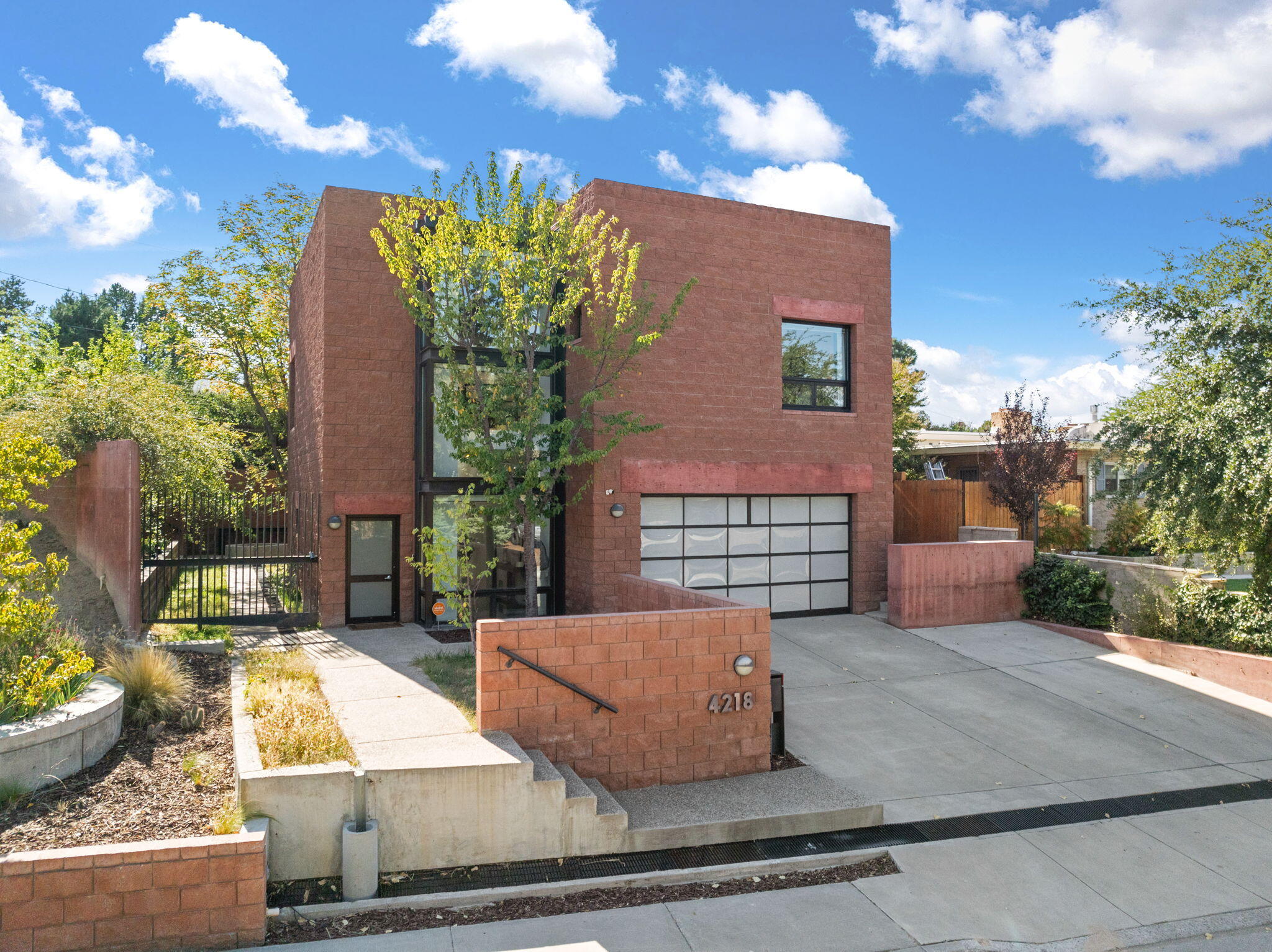 An architectural gem with surprising functionality - busy professionals wanting secure, tranquil ''away from it all'' feel; families with kids needing their own ''space;'' ready to downsize to something unique & exceptional; entrepreneurial space for meetings, entertaining & modern living.  Experience a sophisticated sanctuary in Altura Park that perfectly blends contemporary luxury with urban convenience. This exquisite property features soaring ceilings and large windows that create an airy and inviting ambiance while still embracing privacy. The open-concept kitchen and living areas are designed with custom built-ins and stunning minimalist cabinetry, designed for both form and function. Also on the main floor, the owner suite is a true retreat, featuring custom wardrobe storage and a