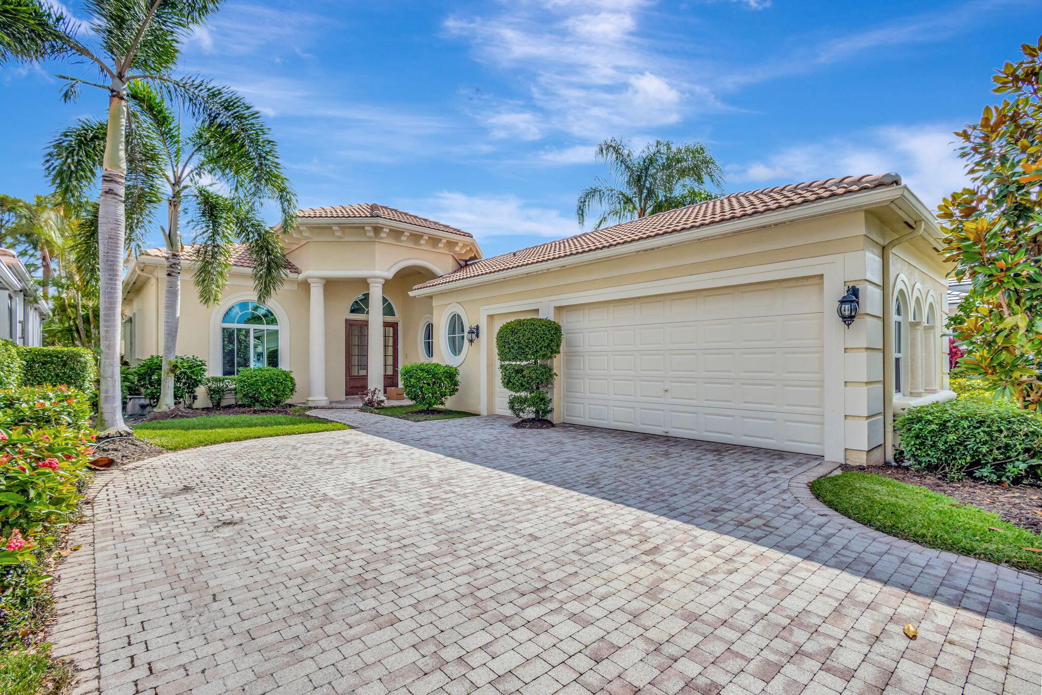 This inviting 3 bedroom, 3 bathroom home offers stunning views of the 6th green on the Sunset Course at prestigious Mirasol Country Club, all within walking distance to the Clubhouse. Surrounded by lush tropical landscaping, the property provides a serene golf course backdrop. The open and spacious floor plan is perfect for relaxation, filled with natural light and enhanced by impressive 14-foot tray ceilings. Recent upgrades add to the home's appeal, including a newer AC unit, primary bedroom closet, fresh interior paint, accordion shutters on side windows, and hurricane impact windows and doors at the front and back. Additional enhancements include updated door hardware, electric roller shades, window treatments, and remodeled bathrooms and laundry room tops. A spacious pantry was added in the kitchen. Enjoy the exceptional amenities of Mirasol Country Club, which include a luxurious spa and fitness center, 15 clay tennis courts, pickleball courts, two championship golf courses, a practice range, a family sports complex, special interest clubs and a full calendar of year-round social events.