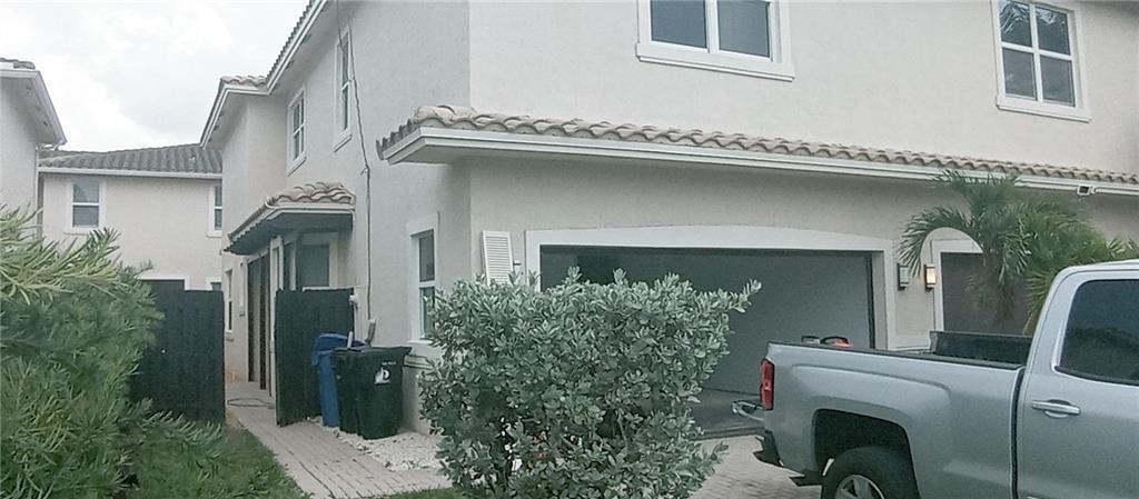 No HOA! Spacious 3/2.5 Townhome with Den/Office & 2-Car Garage – Built in 2007, Looks Like New! This beautifully maintained townhome offers 3 bedrooms, 2.5 bathrooms, and a versatile den/office. Featuring tile floors throughout, the home boasts modern finishes including granite countertops and stainless steel appliances. The open and airy living spaces include a large living room and an open loft, perfect for additional relaxation or entertainment. The master suite is huge with walk-in closets, while the additional bedrooms provide ample space for family or guests. Enjoy the convenience of a washer and dryer, as well as a half bath on the first floor. The privacy-fenced backyard.