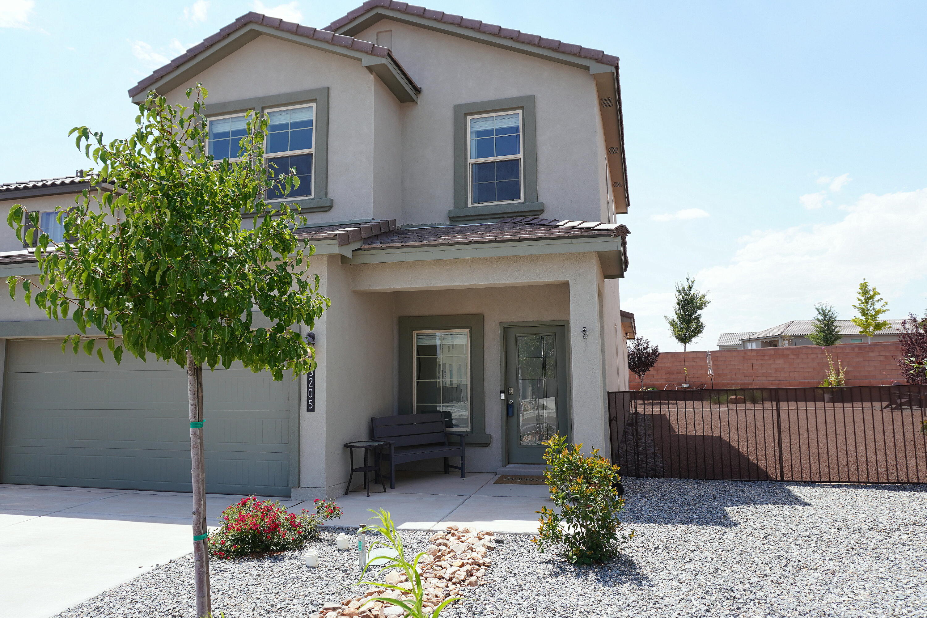 Discover this meticulously maintained 4-bedroom, 2.5-bath home on a premium pie shaped lot with fully landscaped front and back yards. The spacious, open-concept design seamlessly connects the contemporary kitchen--featuring quartz countertops, Whirlpool stainless steel appliances, a walk-in pantry, Island all open to the dining and living areas, perfect for entertaining. The primary suite, located on the main floor, includes a custom closet and a luxurious bath with a walk-in shower. Upstairs, enjoy a versatile loft/den, three bedrooms, and a full bath. Amazing views of the Sandia Mountains from the loft/den. This home is truly ''Move-in Ready'' combining style and comfort in an unbeatable location near shopping, dining, and hospitals.
