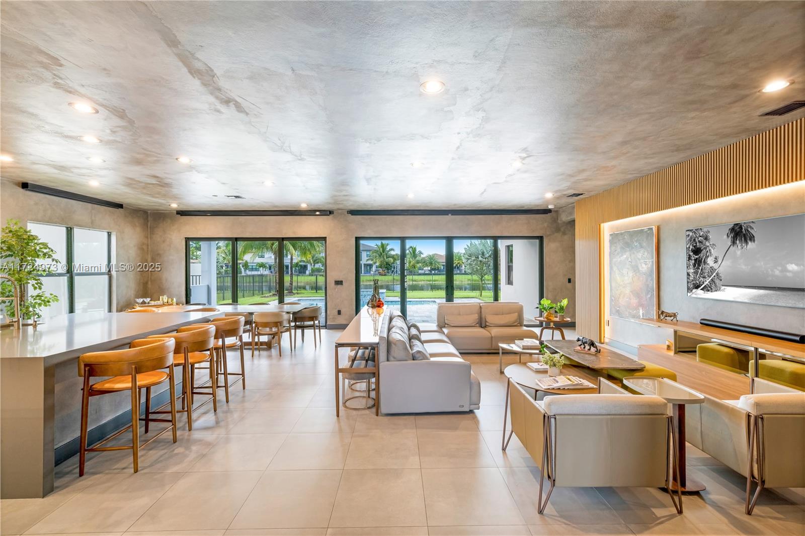 Investors only. This two-story New York style contemporary home effortlessly blends modern luxury with artistic flair in the highly sought-after Lotus (Sumatra Model). Its exterior is a harmonious fusion of clean lines and dark finishes, creating a striking contrast against the vibrant cityscape. The living areas boasts floor-to-ceiling windows that flood the space with natural light, creating an inviting atmosphere grounding the space in warmth and elegance. The dark clean finishes of the walls provide an ideal backdrop for showcasing an eclectic mix of bohemian-inspired furnishings and contemporary art pieces. This home includes a wine cellar that is a sumptuous sanctuary for wine enthusiasts, and a movie theater right at home for a luxurious retreat for cinephiles.