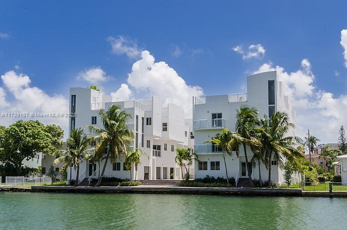 Townhome for sale in Normandy Isles in Miami Beach. Situated just minutes away from the iconic Miami Beach shoreline, you'll have easy access to pristine beaches, world-class dining, shopping, and entertainment. With vibrant areas like South Beach and the famous Ocean Drive nearby, the excitement of Miami is at your doorstep. This townhome boasts 1894 square feet of living space, featuring 4 bedrooms and 3 full bathrooms, ideal for families or professionals looking for both comfort and flexibility. Just renovated with high-end finishes, this property includes sleek modern kitchens with stainless steel appliances and quartz countertops. The living areas feature large windows that let in tons of natural light, creating a bright and inviting atmosphere. Boat slips available.