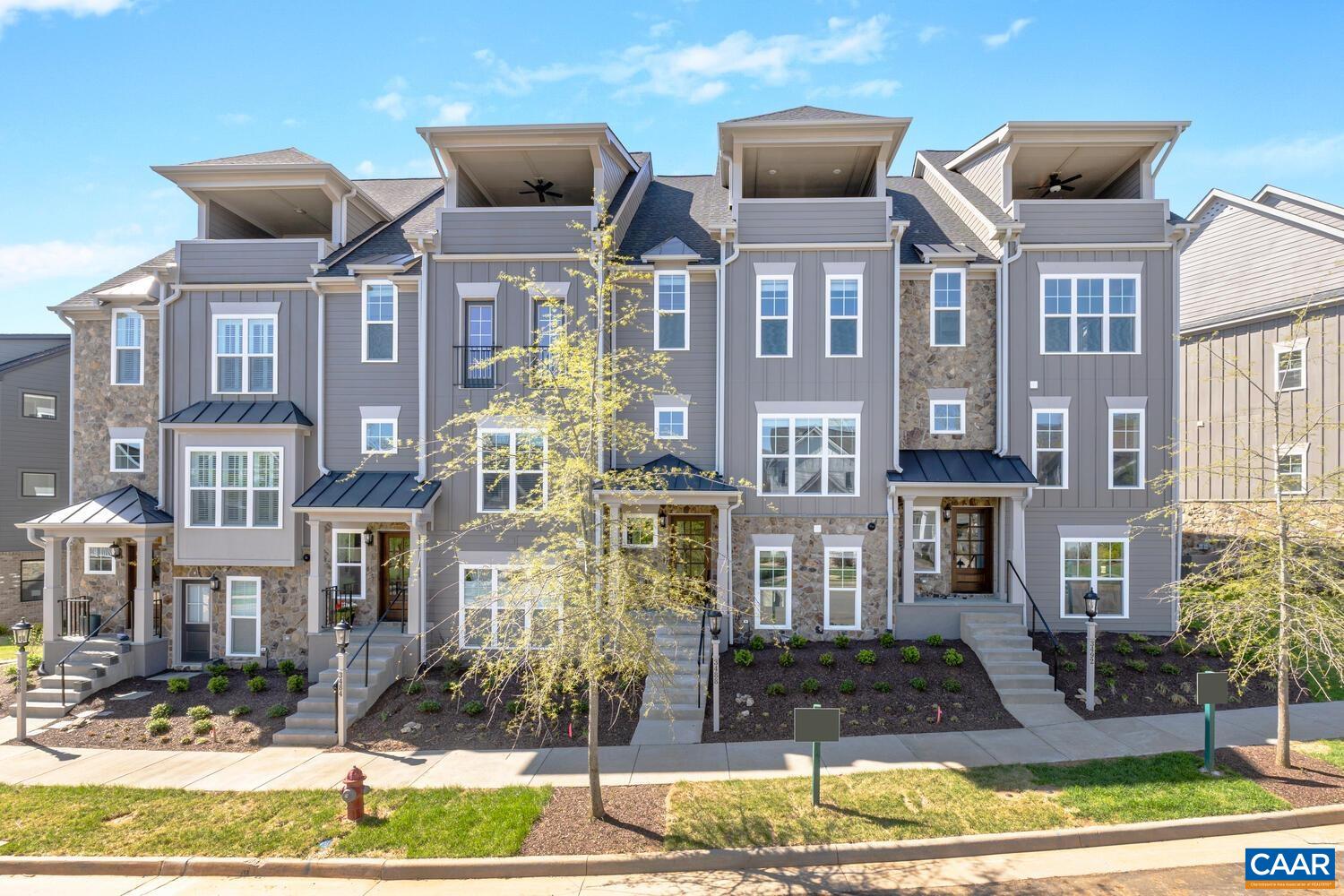 Move-In Ready, End-Unit Townhome with Rooftop Veranda and Blue Ridge Mountain Views! This End Unit Towne includes 4 Finished Floors, Residential Elevator servicing all 4 Floors, Rooftop Veranda and potential rental income with 1st Floor Bedroom/Bath dependency/ADU. This townhome is designed to capture the beautiful Crozet views while incorporating thoughtful, included features and spacious living spaces throughout. Starting with a 2-Car Garage, finished bedroom and full bath dependency/ADU on the lower level, you can head to the open 2nd Level for entertaining in your Kitchen, Great Room with Fireplace, Dining Room & spacious Trex Screened-In Deck (plus a half bath!). The 3rd Level is home to the private Owner's Suite & Bath, second bedroom, full bath and Laundry Room. The 4th Level comes with a finished Rec Room, full bath, Private Study & show-stopping Veranda. Located in amenity-filled Old Trail, you can enjoy all that this neighborhood & Crozet have to offer! This Townhome is ready for March 2025 Move-In!