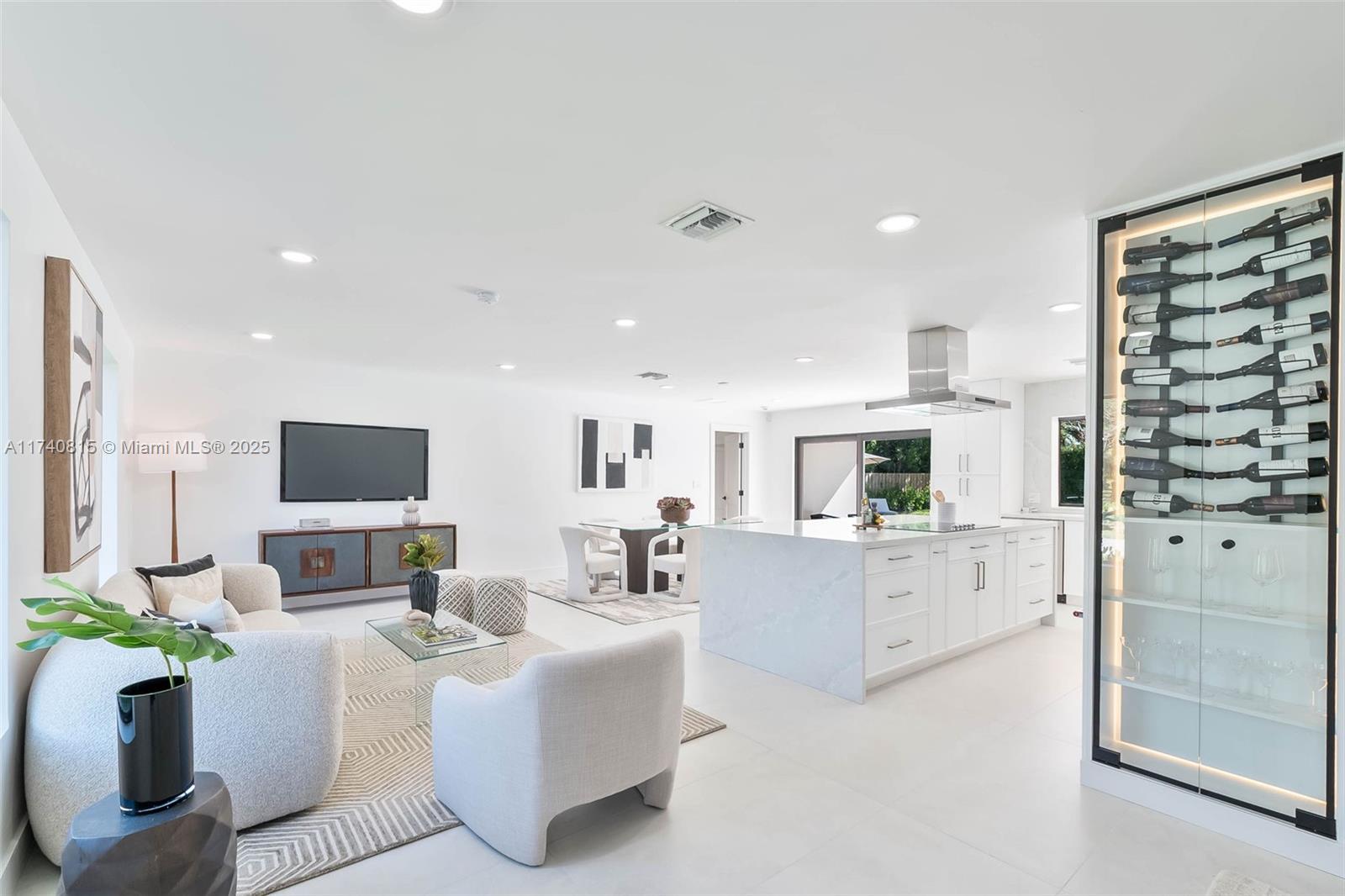 Complete Renovation (with permits) in N Palmetto Bay! Stunning 4 bedroom 3 bath smart home features open concept design. Eat in kitchen showcases center island with quartz countertops, custom wine bar, and Kitchenaid appliances. Porcelain tile floors throughout. Impact windows and doors. Luxurious primary suite with spa like bath with soaking tub & custom closet. Split plan includes junior suite. Den easily converts to 5th bedroom. Dedicated laundry room. 2022 AC and new duct work. All new plumbing, septic system, electrical, tile roof, and paver driveway. Covered terrace, shell stone patio, pebble tech pool. Fenced corner lot on quiet cul de sac. This is a must see!