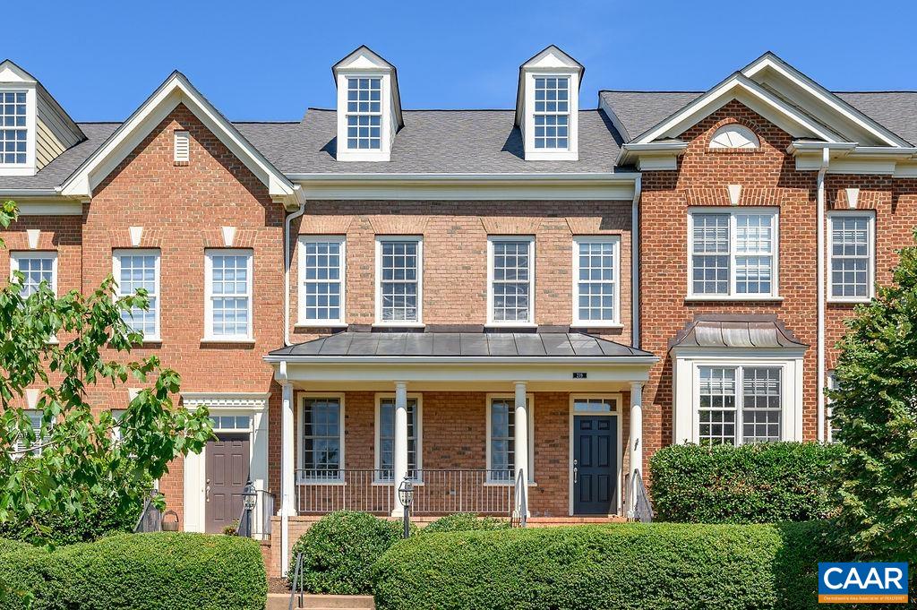 This 3BR, 2.5BA brick townhome overlooking Old Trail Commons has been well maintained and offers large 2 car detached garage with loads of storage.  An easy walk to downtown Crozet(Library, Piedmont Place -restaurants, ice cream) and the Old Trail town center (Grit Coffee,ACAC fitness & restaurants). The flexible open living spaces on the main level feature cherry hardwoods throughout, an eat-in gourmet kitchen open to sunny family room plus separate living & dining rooms. Attractive & functional kitchen w/ cherry cabinets, granite counters, gas range, a built-in desk/workstation and an island with breakfast bar. Finishes include gas FP with stately mantle & stone surround, french doors to a rear courtyard, fresh paint throughout, new HVAC systems, and many other extras. There are 3 bedrooms & 2.5 baths upstairs. Spacious owner's suite has a walk in closet, bathroom with two separate vanities, large tile surround corner soaking tub and separate shower. Two additional bedrooms share a hall bathroom with double vanity, and the laundry room is conveniently located on the 2nd level. Low-maintenance, fenced back yard features privacy fence, patio, HOA manages the landscaping.