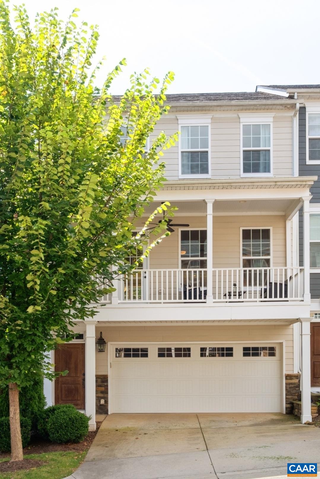 OPEN HOUSE: Sunday, 1:00-4:00! The main floor boasts an open concept allowing natural light to flow through. The large upgraded kitchen with gas range and tons of cabinet and counter space is made for the home chef. The dining area is perfectly situated for entertaining. All this opens to the large living room with fireplace. Real hardwood floors flow throughout the living space. Two outdoor spaces give you tons of flexibility. Walk out to your patio perfect for grilling & enjoying some privacy or choose your front balcony with plenty of space for drinks or dinner while enjoying your mountain view. Go upstairs to find your master bedroom suite with a walk-in closet. Your master bath has two vanities & an upgraded tiled shower. Down the hall you will find two more bedrooms & a full bath. A laundry completes the bedroom level. On your bottom floor you will find a terrific 4th bedroom which is a perfect guest suite. The room is also large enough to be a family room or rec room.  The two car driveway & garage gives you plenty of parking & storage. Your new neighborhood is great with a clubhouse, gym, playground, & dog park along with food trucks & wine socials. Just minutes to Downtown, Wegmans, UVA & I-64. Come see it now!