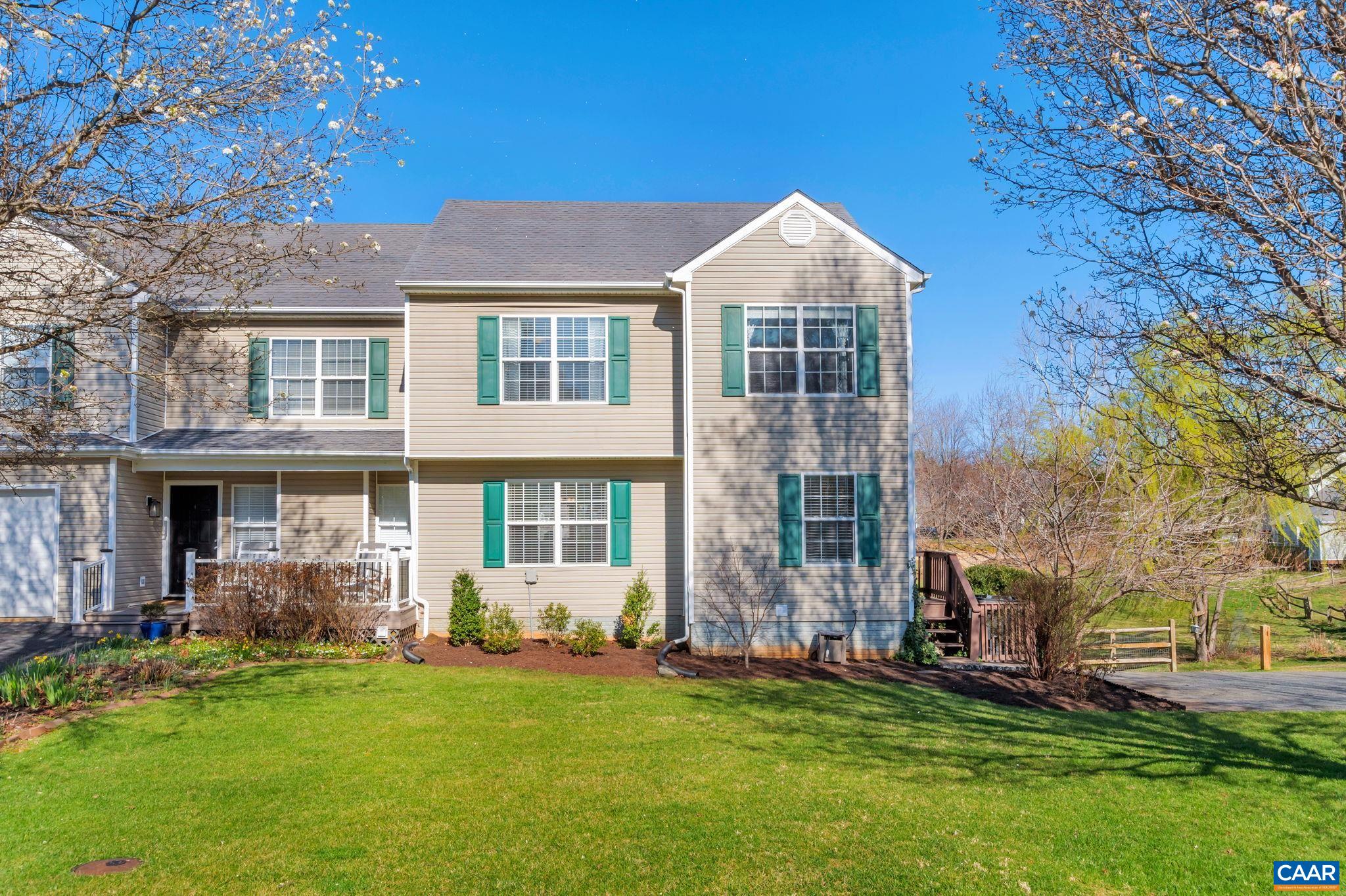 End unit home on a quiet cul-de-sac less than 4 miles to Downtown Charlottesville and just a stones throw to 5th Street Station with Wegmans, movie theatre, shopping, and restaurants. The fenced backyard with mature landscaping backs to nicely manicured common space for additional privacy. This 3 story home features open concept living on the main level with spacious kitchen, separate dining, and living room with a gas fireplace. The kitchen has been updated with granite counters, white cabinets, stainless appliances and classic subway tile backsplash. Upstairs features three bedrooms including an owners suite w/ spacious en-suite bath and walk-in closet. The finished walkout basement includes a great rec area with door leading outside, a separate nook used by current owners as guest sleeping space, a full bath, and a large laundry room with added cabinetry for additional storage. All of this in amenity rich Lake Reynovia with community pool and tennis, and so convenient to UVA, downtown, I-64, and both hospitals.