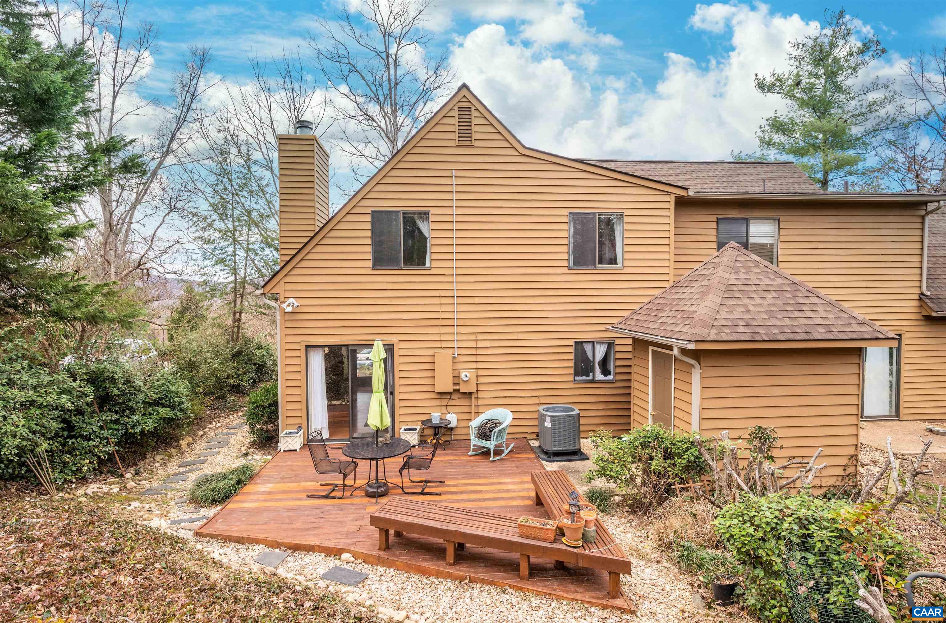 This charming two-story home conveniently located near downtown Charlottesville and UVA features 3 bedrooms plus a bonus room that could serve as a 4th bedroom or study, along with 2 updated baths. The open main floor plan is filled with natural light. Living room with a custom-built bookcase and a cozy wood-burning fireplace, master bedroom and bath, along with an updated kitchen complete with white painted maple custom cabinets, granite countertops, island, ceramic tile floor, and new SS appliances installed in 2019. The kitchen is adjacent to a comfortable dining area, perfect for family meals or entertaining guests. This home boasts numerous upgrades, including Trane HVAC/variable speed/whole house dehumidifier and air purifier, and AO Smith water heater. The attic and eaves insulation have also been recently updated. Exterior maintenance is a breeze with the HOA covering all roof and cedar siding maintenance, as well as trash, lawn care and snow removal for a monthly fee of $190. The yard features trees and border bushes, beautiful mountain views from the spacious deck that also features built-in bench seating and a storage shed. The yard has been newly fenced in the back. This home is a must-see and won't last long!