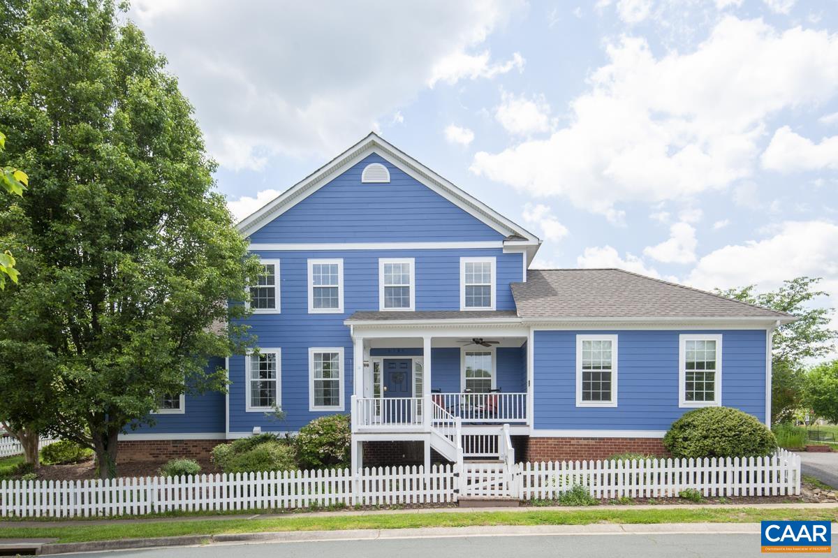 Offering the ideal balance, this generous four bedroom, three and a half bath home on a corner lot adjoins an expansive community park. A darling white picket fence frames the recently-painted low-maintenance hardiplank exterior. Step up to the covered front porch & inside to handsome hardwood floors, updated fixtures, HVAC, & refreshed paint throughout, a sunlit dining area connecting to a renovated kitchen with granite countertops & soft touch cabinets, living room with built-ins, gas fireplace, & a delightful new sunroom with garden & park views. The first-floor primary suite boasts new hardwood floors, updated en-suite bath with dual vanities, soaking tub, separate shower, & walk-in closet. Huge two-car side-entry garage offers incredible storage & a convenient entrance up to the main floor through the combo laundry/mudroom aside the half bath & into the foyer. Three well-situated bedrooms on the second floor with plentiful closet space & two full baths, another of which is ensuite. All of this in wonderful Waylands Grant, enjoying parks, playgrounds, nature trails, sidewalks & bike trails to Downtown Crozet's shops, coffee shops, cafes, library, seasonal farmer's market, & community.