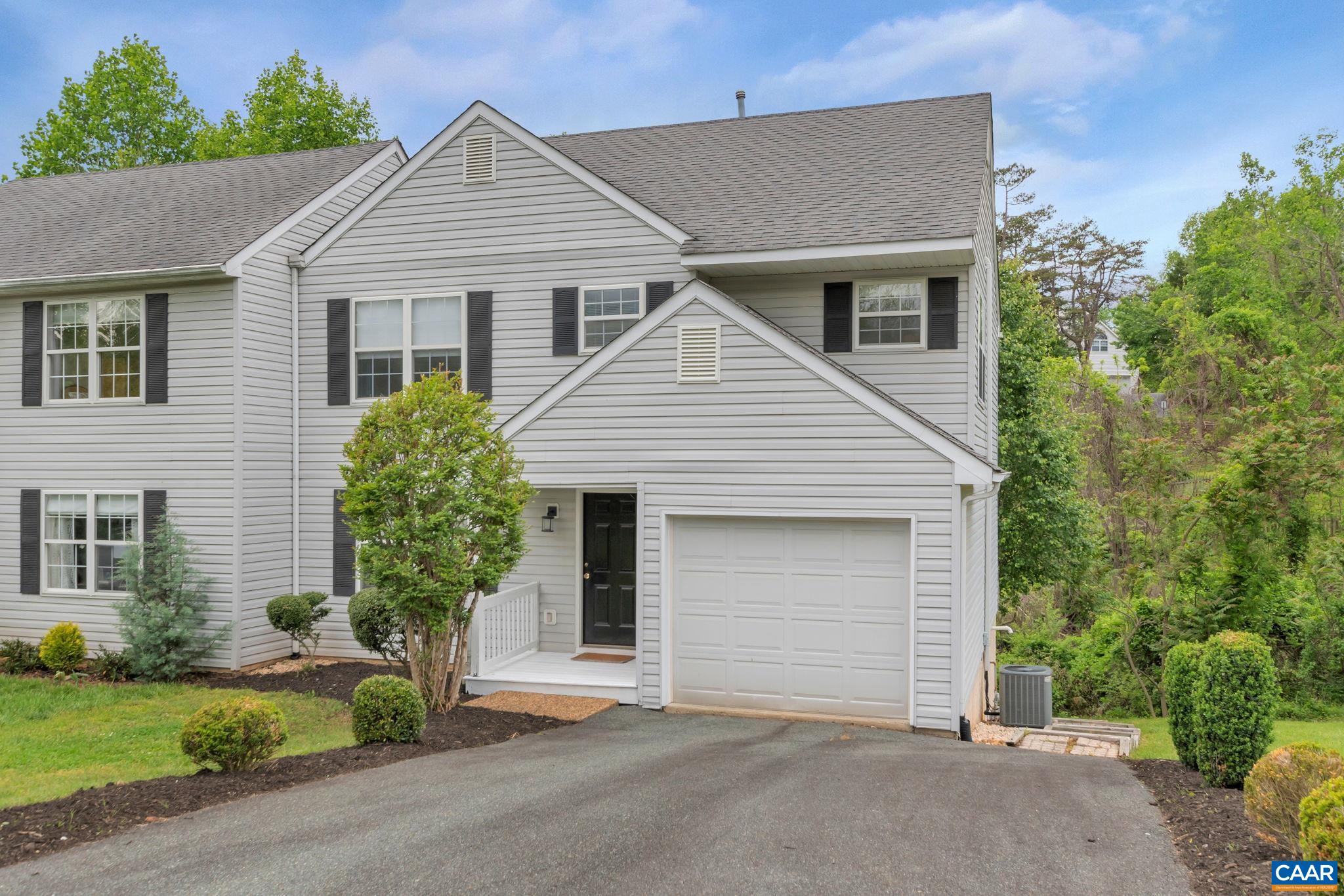 OPEN HOUSE Saturday, May 20th 1PM-3PM. Move-in ready Lake Reynovia townhome with a newly renovated kitchen, full finished basement with 4th bedroom potential, and even a view of the lake! This layout lives more like a single family home with main level garage, formal dining, eat-in kitchen that walks out to the rear deck and living room with gas fireplace. Upstairs you'll find a huge primary bedroom with en suite bath, two generous sized bedrooms, full hall bath, and a proper laundry room plus pull down stairs to large attic for extra storage. The newly refinished basement with luxury vinyl plank includes a large L-shaped rec room with closets that can be easily divided for a 4th bedroom with attached full bath. Enjoy the pool, tennis, trails, lake and other amenities that Lake Reynovia has to offer in time for summer!