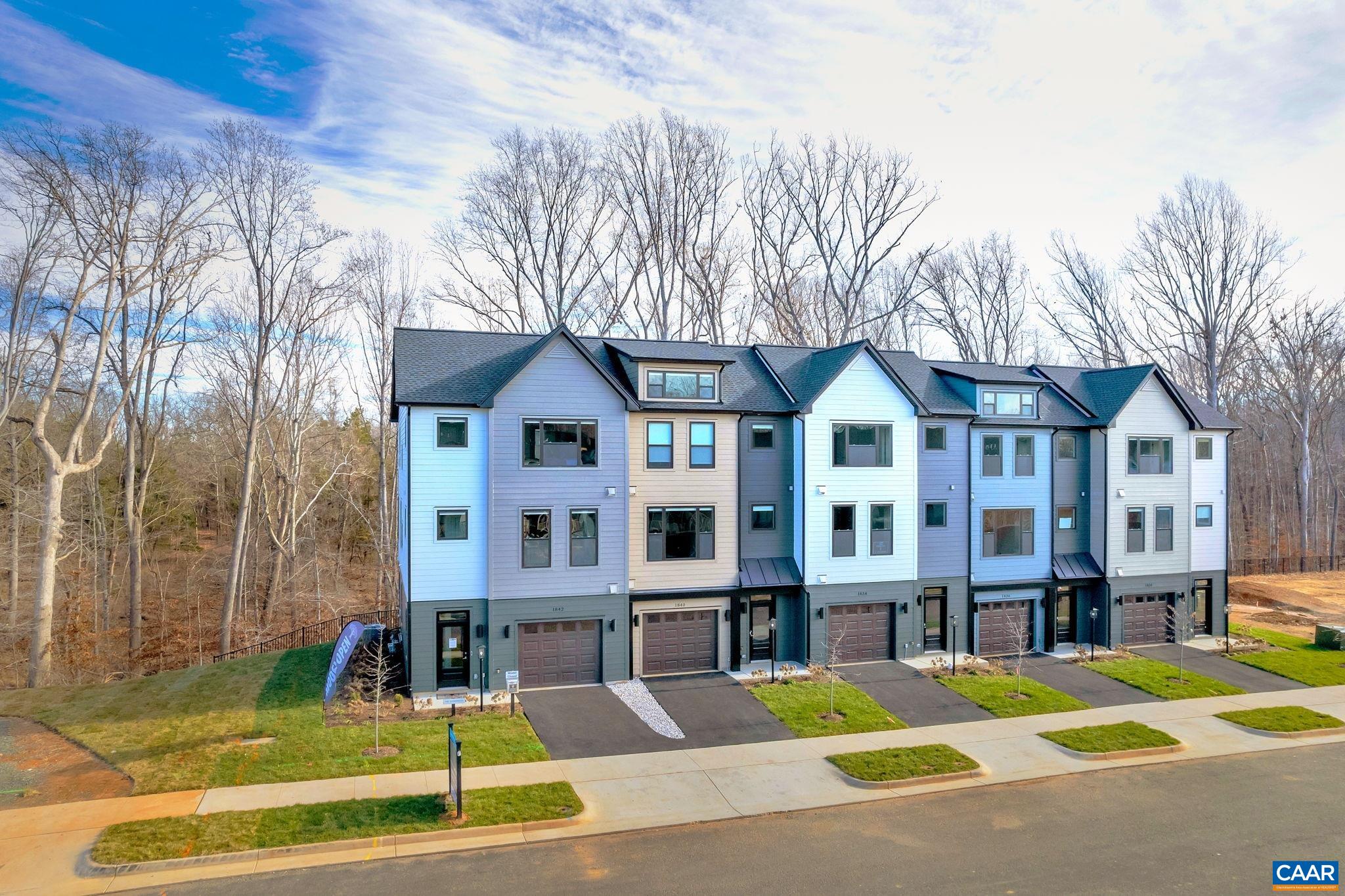 This Bainbridge interior townhome features 3 BR, 3.5 bath, flex room/office, & attached garage. A thoughtfully designed open floorplan includes spacious great room, dining,& well-appointed kitchen w/ oversized 9' island, gas cooking, chimney hood, granite counters & painted maple cabinetry. An oversized 8’ X 20’ TREX deck backs up to green space & mature trees for relaxing evenings, morning coffee, and outdoor entertaining. Belvedere is an established community centrally located to all things C'ville, just 2 miles to the Downtown Mall & RT 29 shopping, 5 miles to UVA, and surrounded by nature & the Rivanna Trail. LAWN CARE & TING FIBER internet included in HOA. All homes are 3rd party tested for energy efficiency & come w/ PEARL GOLD certification. Similar Photos.