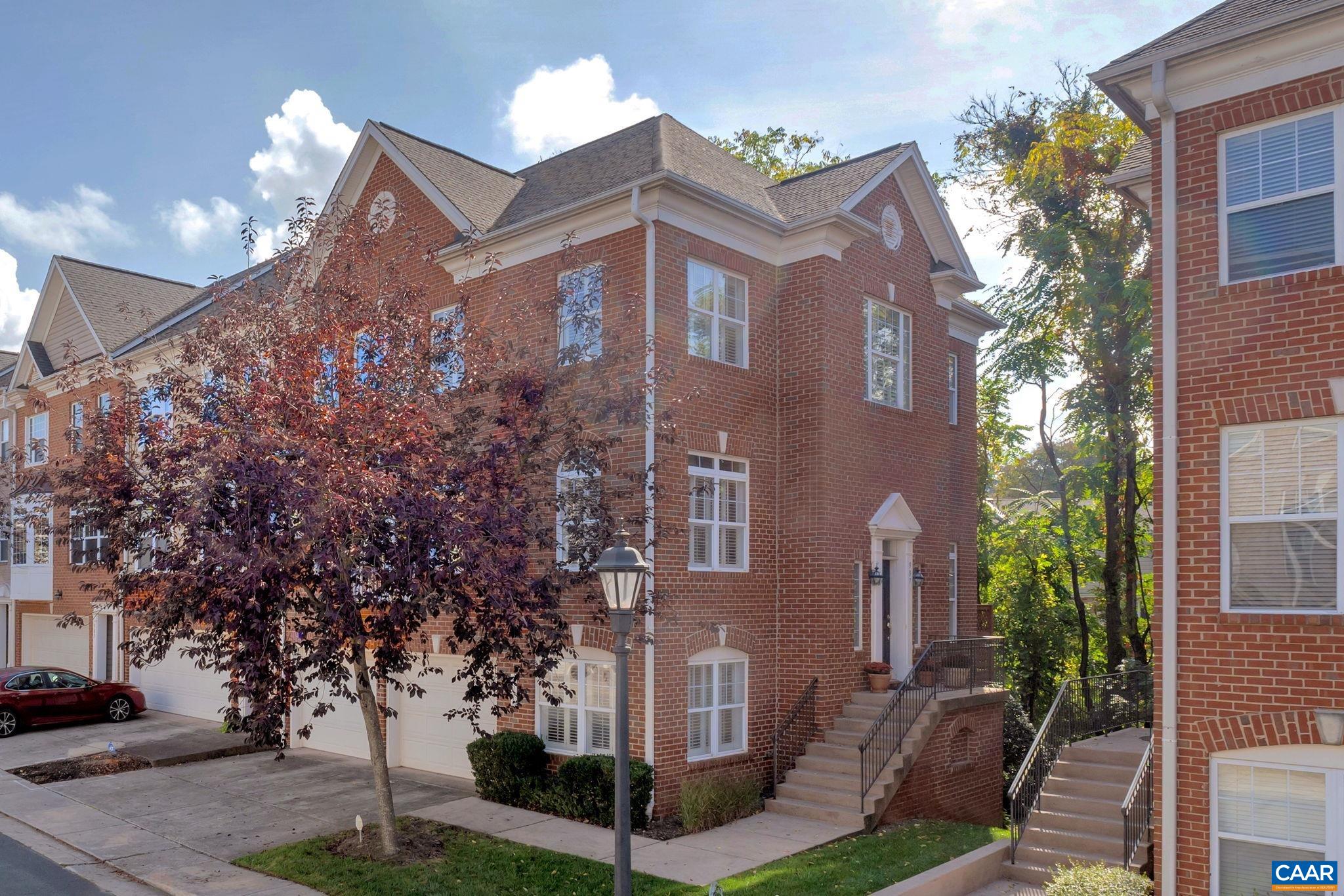 Immaculate brick end unit with 2-car garage and huge deck backing to trees. This one is sure to impress! All levels are above grade including the walkout terrace level rec room that could be a 4th bedroom en suite with full bath and walk-in closet. Home office with two walls of windows. Beautiful upgrades including elite custom plantation shutters throughout the majority of the home, genuine hardwood floors, built-ins, crown molding and under cabinet lighting in the kitchen. Spacious, bright family room with palladium window opens to an entertainment size deck. Open living/dining room with gas fireplace flanked with built-ins. Gourmet kitchen complete with pantry closet, granite counters, gas cooking and stainless appliances. French doors open to the upper level owners suite with tray ceiling, two walk-in closets and en suite bath featuring a double sink vanity, jetted tub and glass enclosed walk-in shower. Convenient upper level laundry, too. One owner. Lightly lived in. Impeccably maintained. 2018: New upper level HVAC, W/D & LG fridge.