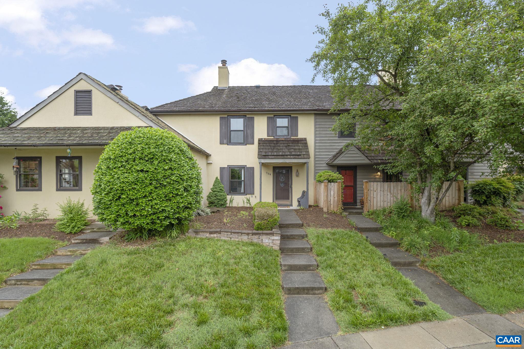 Lovely + AFFORDABLE home in desirable RIVER RUN neighborhood, walkable to Pen Park + Rivanna Trail! CURB APPEAL abounds in this character-rich stucco townhome set on an elevated lot w/ gardens overlooking a peaceful common area. Enter under a covered front porch into a foyer feat. open staircase + half bath for guests.  A bright WHITE KITCHEN offers a thoughtful layout + newer appliances (double-oven, NEW built-in microwave) w/ convenient access to NEW washer/dryer. The cozy living room feat. a FIREPLACE + ample room for dining. Upstairs, 2 comfortable bedrooms + full bath. NEW WINDOWS THROUGHOUT.  Enjoy your coffee on a private patio + FENCED BACKYARD.   River Run is sought-after for its private community POOL + easy walk to PEN PARK amenities inc. the 18-hole Meadowcreek Golf Course w/ Clubhouse & Pro Shop, 8 tennis courts, a Little-League baseball diamond with batting cage, volleyball court, 3 outdoor picnic shelters, playground-tot lot + 20 exercise stations winding along the fitness trails of the Rivanna River. Pen Park also hosts a seasonal farmer's market every Tuesday from May through September. So much to love!
