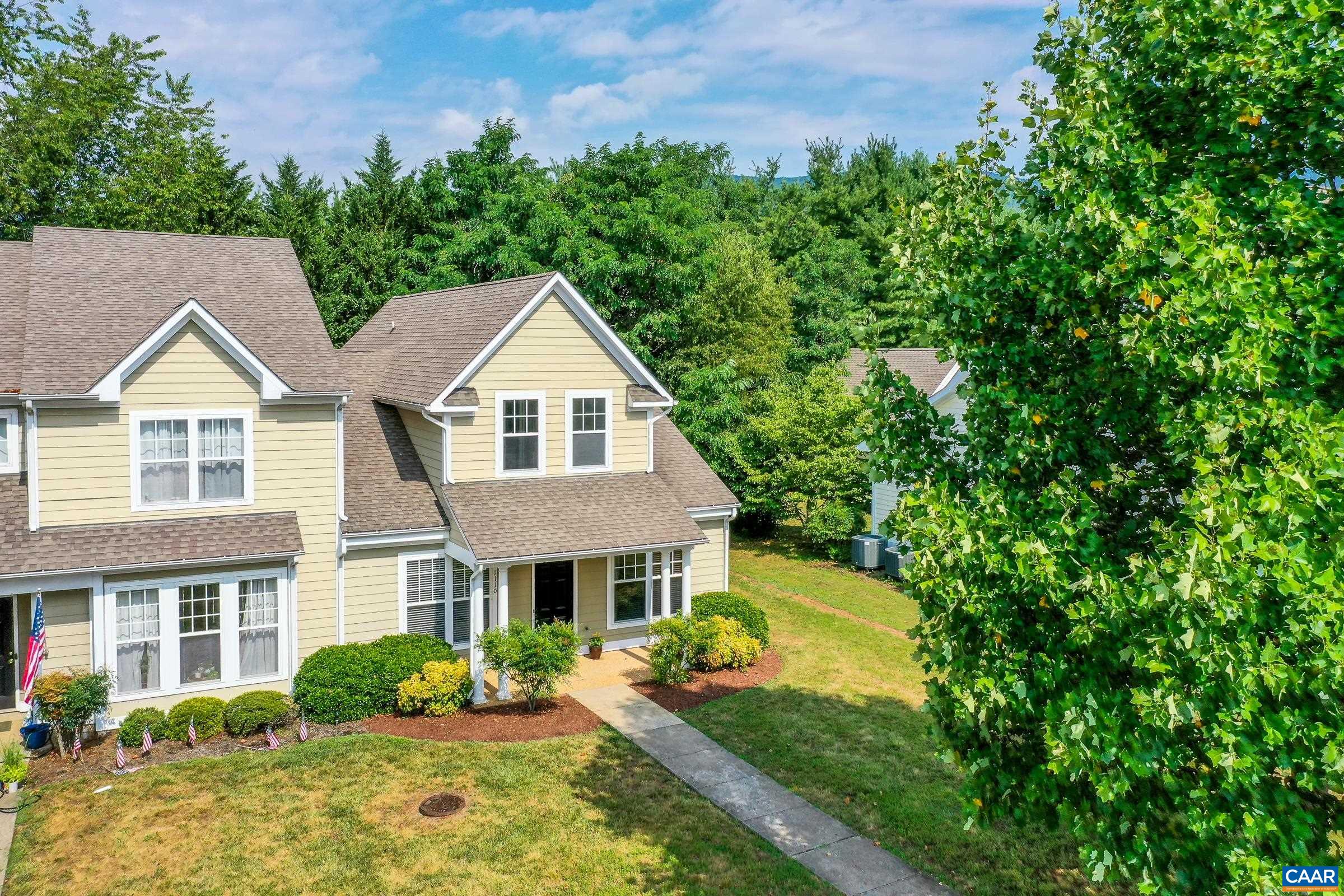This deceptively large end-unit townhome with new HVAC in Crozet is a must-see! As you enter this light-filled home, the hardwood floors and fresh neutral paints throughout the main level welcome you in. To the right of the foyer is a large home office with glass doors for privacy.The large living room boasts a ceiling fan for comfort. Gourmet kitchen features new stainless appliances, oak cabinets, and an island with new farmhouse light fixture. Large breakfast nook opens to private back yard with patio to enjoy outdoor dining. Main level owner's suite features a walk-in closet with custom built-ins, and a private bathroom with tub/shower combo and dual sink vanity. Upstairs, you'll love the new whitewashed laminate flooring throughout! Two additional bedrooms with high ceilings, and large closets share a full hall bathroom, and the laundry is upstairs for convenient laundry day. Open space on second floor could make a unique homework zone, play space, or cozy den. Unload groceries with ease from the 2 dedicated parking spots directly in front of the home.