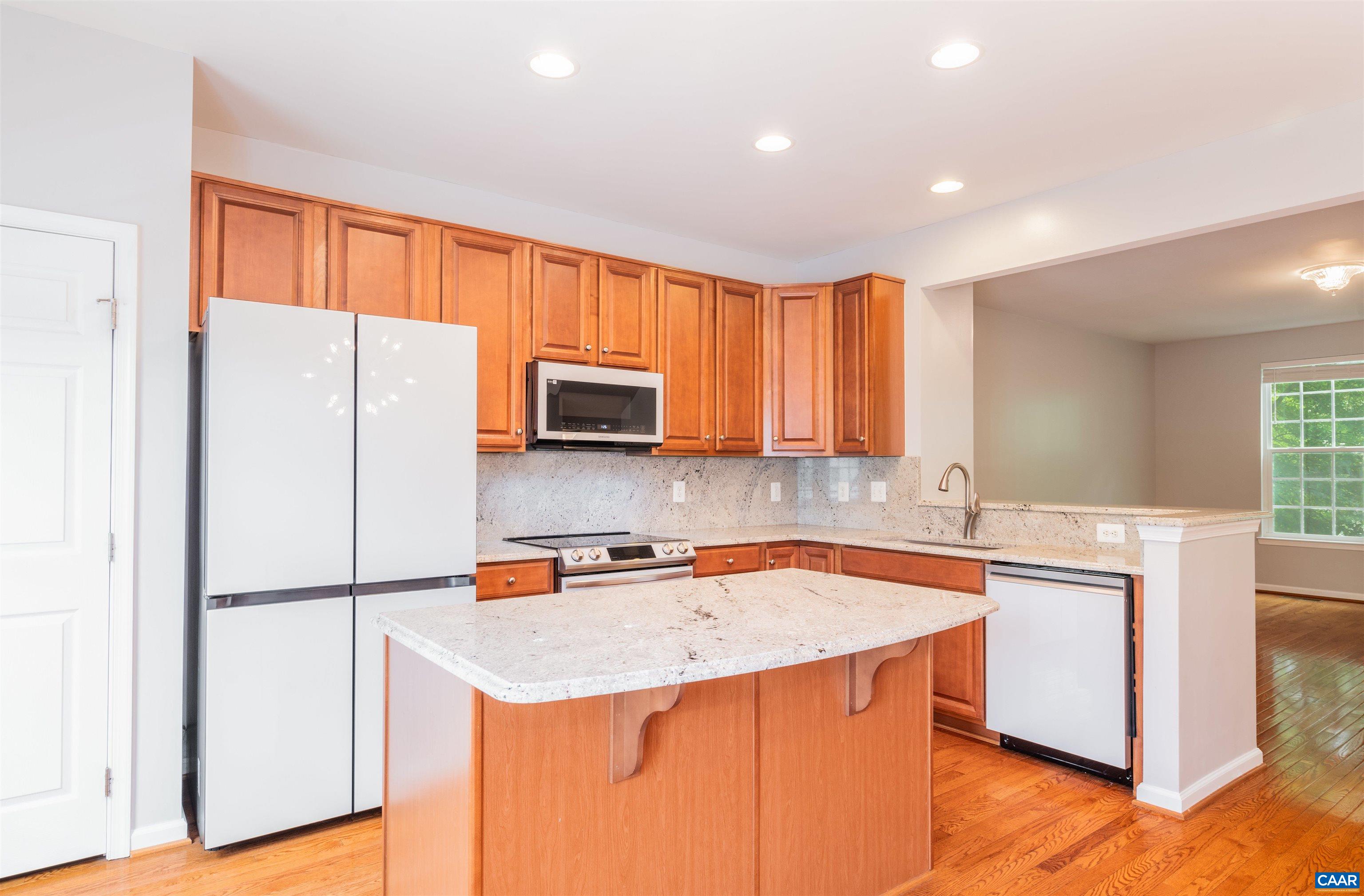 This 3-bed, 2-full/2-half bath, 1,987-fin sq ft townhome is favorably located on a peaceful cul-de-sac street within Charlottesville/Crozet's Liberty Hall neighborhood, conveniently situated across the street from Harris Teeter, 5-minutes from Brownsville Elementary, Henley Middle, and Western Albemarle High School, and only 5-10 minutes from historic downtown Crozet, Chiles Peach Orchard, and a multitude of local award winning vineyards and breweries! This stunning, well maintained and thoughtfully improved home features an attached 200-sq ft garage, a primary suite with a walk-in closet and same floor laundry, and a recently renovated eat-in kitchen featuring newer granite countertops and backsplash, a stainless steel undermount farmhouse sink with disposal, a spacious island, pantry, and luxurious Samsung Bespoke appliances! Enjoy the front yard privacy that the mature Pin Oak trees provide and picturesque park views from the sunny back deck! Open House Sun 06/23 12-2PM!