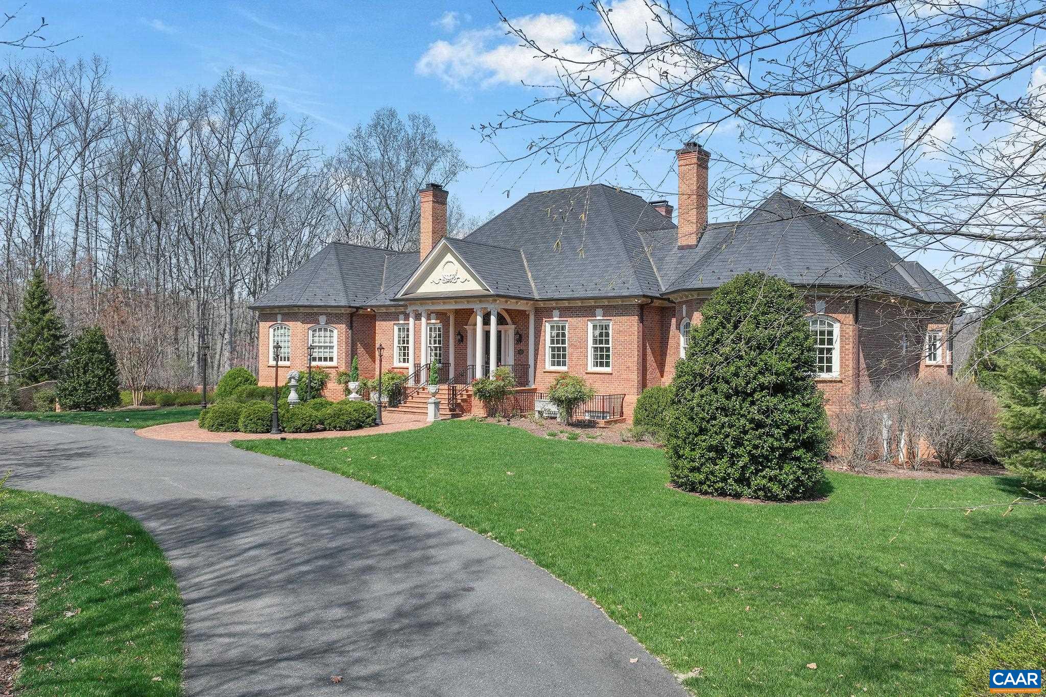NEW PRICE!  Grand Elegance situated on a magnificent landscaped property in the community of Indian Springs! Stately custom-built one-owner brick home offers primarily one level living with timeless appeal, luxurious amenities and plenty of room for extended family. Whether hosting intimate gatherings or extravagant soirees, this home is an entertainer's delight!  The formal DR exudes charm and the formal LR is the perfect backdrop for fireside chats. High ceilings, ornate trim details, built-in cabinetry and spacious rooms throughout. The seamless flow from living areas to screened porches allows for effortless enjoyment. The kitchen is the heart of the home with plenty of counter space and cabinetry plus casual dining.  Multiple auxiliary rooms (including a home Gym) provide flexibility for working from home or enjoying downtime. If you're seeking an extraordinary home with the highest quality construction - this is the one!  Priced way below the 2024 fee appraisal -- don't miss this unique opportunity!
