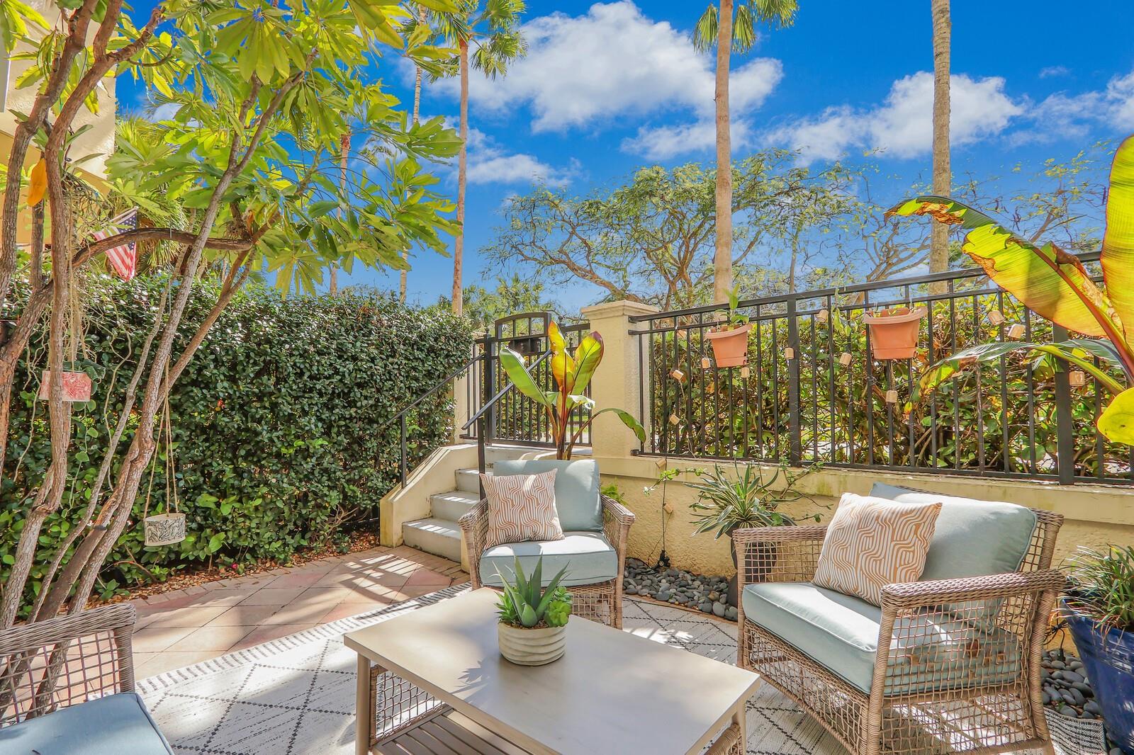 Welcome to this bright 3-story townhome in the sought-after gated community of Harbour Oaks. Explore the nearby nature preserve, perfect for unwinding or walking your dog. This unit includes partial IMPACT WINDOWS, 3 patios, has 2 master suites bedrooms, a versatile den, and 3 full baths. Also featured are tiled/wood floors in the living areas, granite counters, updated cabinets, 2022 stainless steel appliances, a large pantry and a bar. New A/C in 2017 with 12-yr. warranty. Hot Water Heater -2017, kitchen appliances 2022 and washer/dryer 2023. HOA covers cable, home security, internet, water, and all amenities - clubhouse, pool, & fitness center. Harbour Oaks has a resort style pool and spa, fitness center, and is very dog-friendly! Close to Gardens Mall, walk to Carmine's!