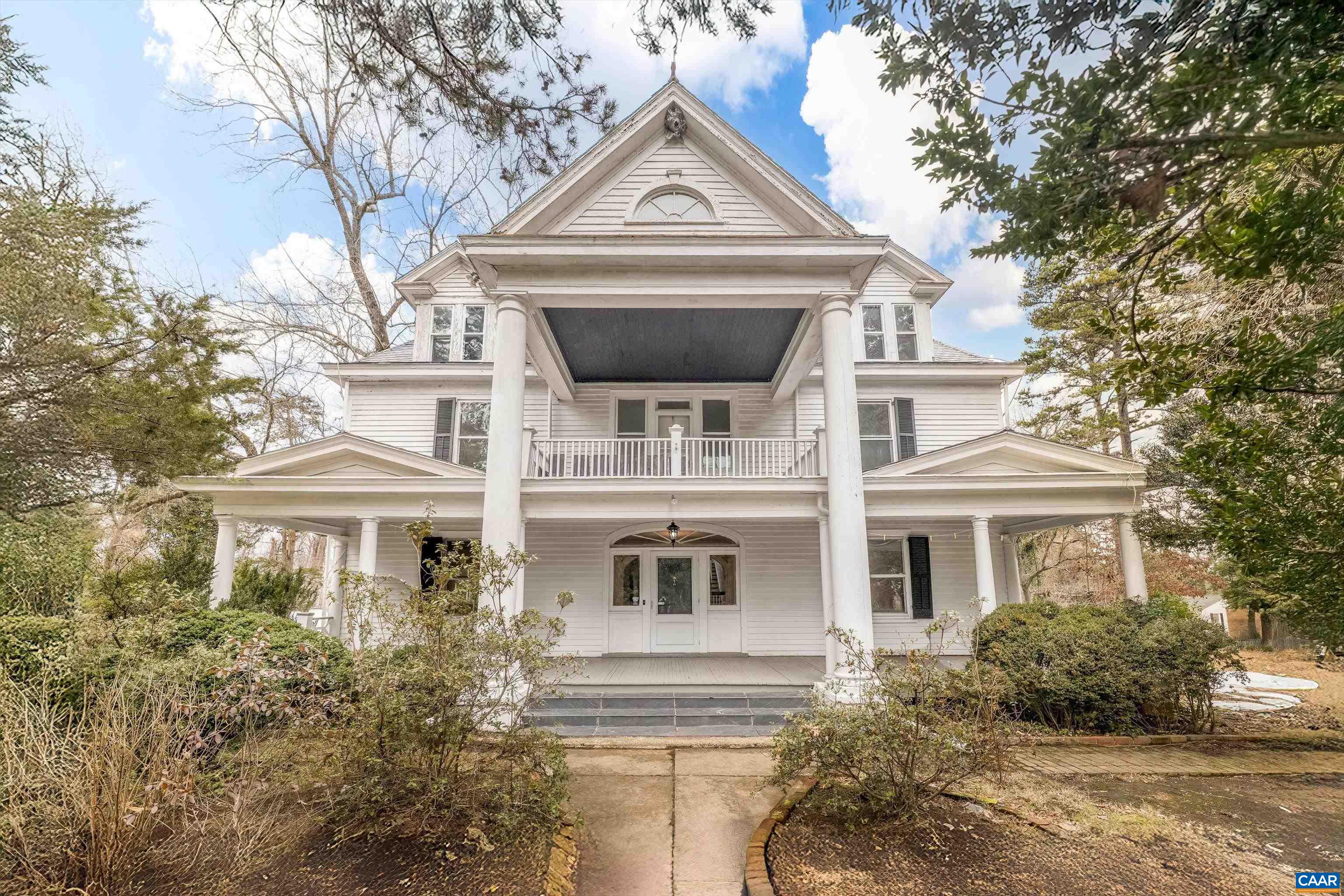 HISTORIC SCOTTSVILLE GEM READY FOR RENEWAL! Just minutes from the James River, this 1914 Greek Revival-style home sits on over five acres, offering endless potential. Classic architectural details include a grand double-columned portico, high ceilings, wood flooring, and multiple fireplaces. The spacious kitchen is a blank slate, ready for customization, while original outbuildings—including a garden house with a working pump—add to the home’s historic charm. With 5 bedrooms and 3.5 bathrooms, this property is perfect for those looking to restore a timeless estate or create a unique bed & breakfast. Located in a serene setting, this property combines the charm of early 20th-century architecture with the tranquility of rural living, all while being conveniently close to local amenities in Albemarle County and Charlottesville. Expand into the large unfinished attic and basement for additional living space.