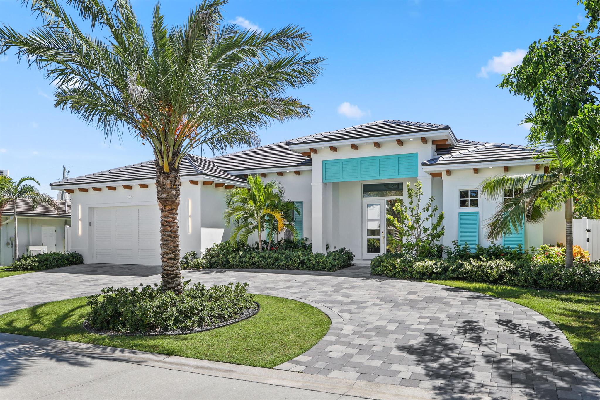 Welcome to your own Island Paradise! Walking distance to the most beautiful beaches in South Florida and top rated marinas for boat lovers and avid fisherman, this new construction 4 bedroom/3 bathroom home is everything you could need and MORE! Built in 2024, no detail was missed from the lusciously landscaped yard with beautiful pool & spa to the meticulously designed interior with designer finishes & fixtures. This property features spacious open living spaces including double island kitchen, a huge master suite with two walk in closets & separate tub and shower that will rivel any spa, spacious guest rooms, office/den, a 2 car garage, large laundry room, covered patio perfect for entertaining! Singer Island is a hidden gem that feels like a true paradise, you'll never want to leave!