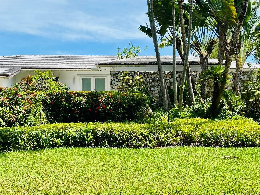 ** Best priced waterfront house in a gated community! **   This beautiful house sits on an elevated lot in prestigious Gables by the sea. It features modern finishes, an updated kitchen w/ quartz countertop, 4 spacious bedrooms (2 en-suites), a home theater/den that can double as a 5th bedroom, and 3.5 bathrooms. Enjoy the safety and tranquility provided by impact windows and doors, covered outdoor area, a large 2 car garage and more. The private designer dock and seawall offer the perfect spot to witness breathtaking sunrises and sunsets. As night falls, the underwater lighting turns your dock into a mesmerizing display, showcasing the marine life and creating the ambiance of your own personal aquarium. Located near top-rated A+ schools. Contact listing agent for showings.