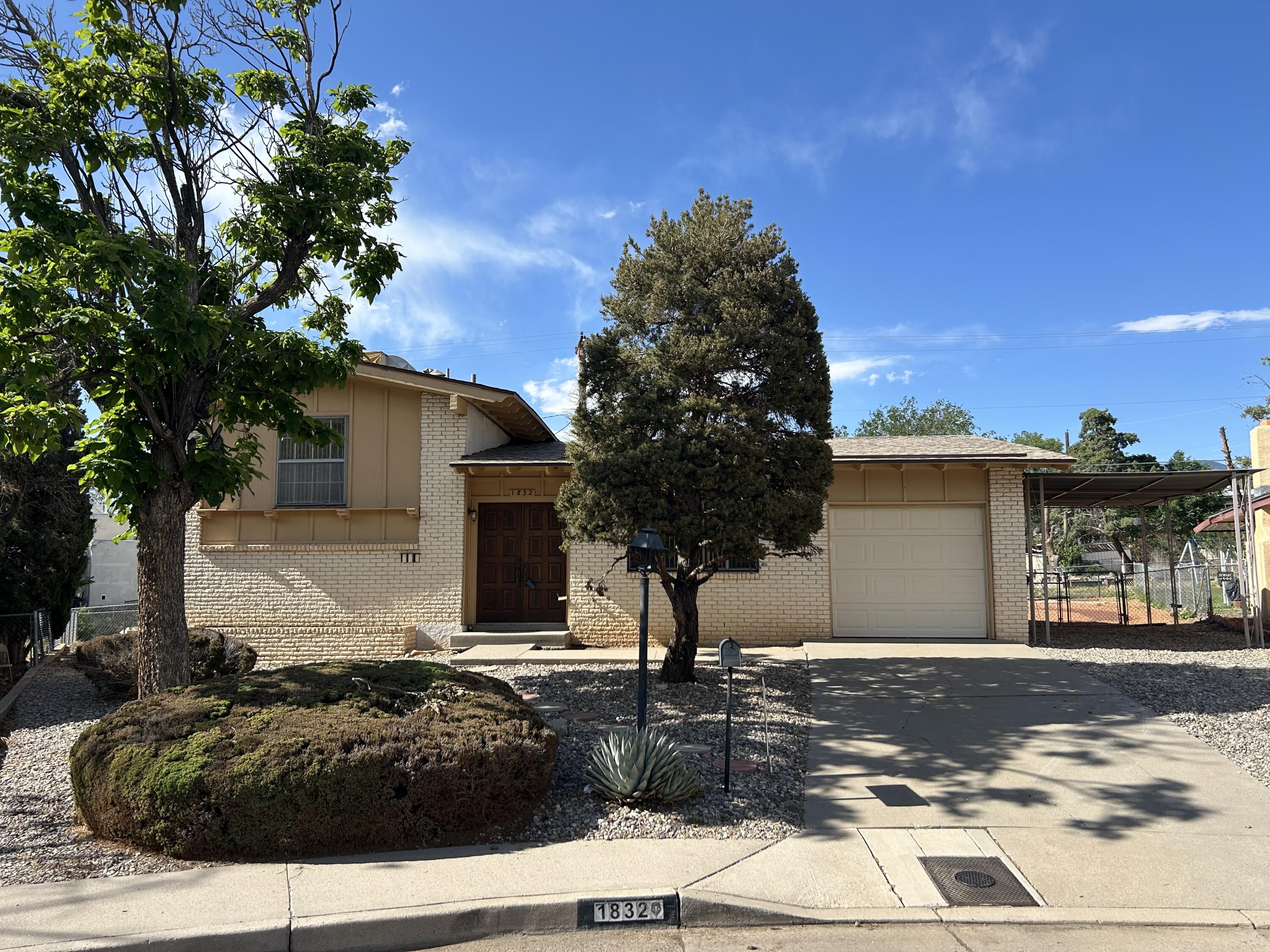 This NE Height's Beauty will take your heart away with it's charm & well cared features. This well thought out designed split level home offers 2 nicely separated living area's. The front living area, which seems more formal, is on the main floor & offers vaulted ceilings. The down stairs living area offers that more cozy feel especially when it offers this nice brink front gas log fireplace and awesome paneling. In this cute eat in kitchen with vaulted ceilings has some must appreciate features like it appliances, well cared for cabinets, counter tops and the brick tile. So great to see such care. The whole house is clean. Large landscaped backyard offers a path for exercising. 1 car garage with opener plus carport off the garage helps with parking in this wonderfully placed cul-de-sac.