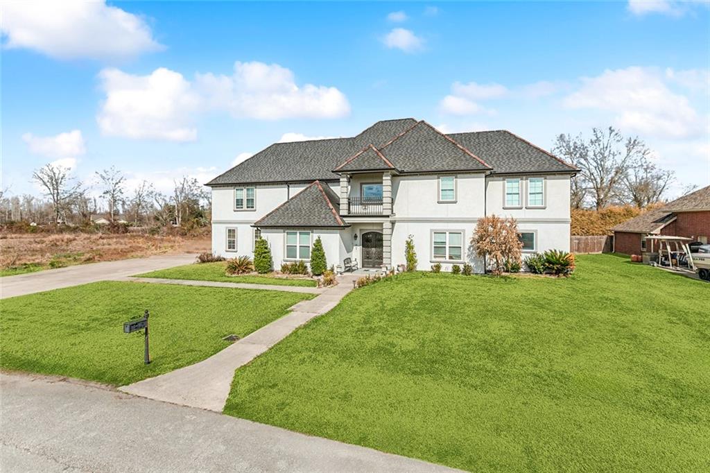 Welcome to Fashion Plantation Estates!  This stunning nine year old home in Hahnville offers so much to enjoy.  Immediately walk in and be greeted by a beautiful stairwell that leads to an upstairs living room, 4 ensuites, and a large home gym.  Off the foyer, you can enjoy a large office, formal living room, formal dining room with a sleek accent wall, den with fireplace and high ceilings.  The airy, open floor plan flows into a fully equipped kitchen, designed with entertaining in mind, is a chef's dream.  Island seating that overlooks the farmhouse sink, large pantry, wine bar, coffee station, Thermador six burner gas stove, vent hood, and separate refrigerator and freezer across from the prep sink.  Off the kitchen, enjoy the eat in kitchen or spacious mud room that leads to a three car garage.  Located on a dead end with a large driveway, this exquisite home offers central vacuum system, home generator, and large covered patio with kitchen and firepit.