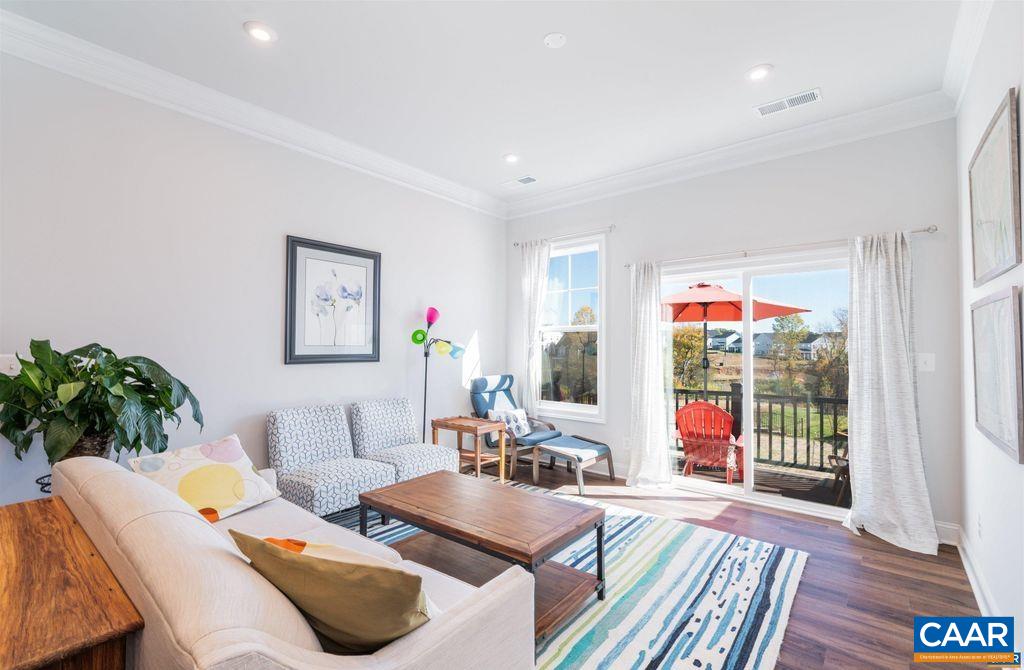 Location, Location! This is not just another townhouse in Crozet! It is located in a small (35 unit), friendly neighborhood, just steps away from Crozet's Community Park (dog park, baseball and soccer fields, pickleball courts, swimming pool and gym), Crozet's Connector trail for walks or runs to the Lickinghole Reservoir and a short walk to downtown Crozet's library, restaurants and shops. It also backs up to common green space. All morning the sun pours in through the back slider and windows, where you can have your morning coffee, lunch or dinner on the deck. Inside you'll find a beautiful kitchen with stainless steel appliances, and quartz countertops, a first floor primary suite complete with two vanities, a spacious shower, and generously sized walk-in closet! Utilize the two upstairs bedrooms with full bath, and den with wall to wall carpeting for family, home office, guest bedroom, or exercise room! All just 10-min from Western Albermarle High School, and 20-min from Charlottesville! Open House Sat 03/08 12-2PM!