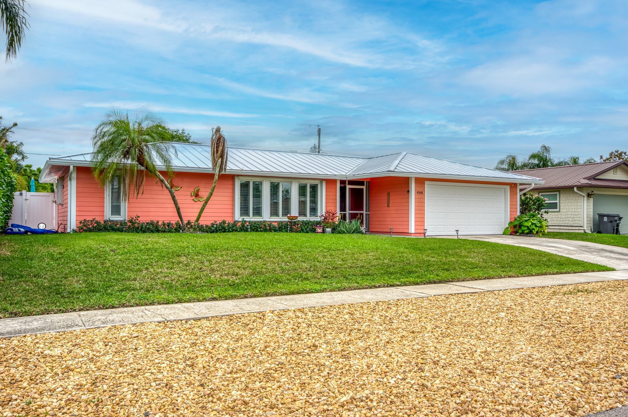 Discover this stunning, fully updated 3-bedroom, 2-bathroom home nestled in highly desired Tequesta. Boasting an open floor plan, perfect for entertaining, this residence offers modern living at its finest. Enjoy peace of mind with full hurricane protection throughout, and revel in the beauty of rich wood floors. The home features a split floor plan for added privacy, and a fully updated kitchen and baths, showcasing contemporary style. A brand new pool surface and pavers create a luxurious outdoor oasis, complemented by a fully fenced yard and a convenient dog run with artificial turf. With a 1-year-old roof, you can rest easy knowing this home is move-in ready. Located in an amazing location, this Tequesta gem is the perfect place to call home.