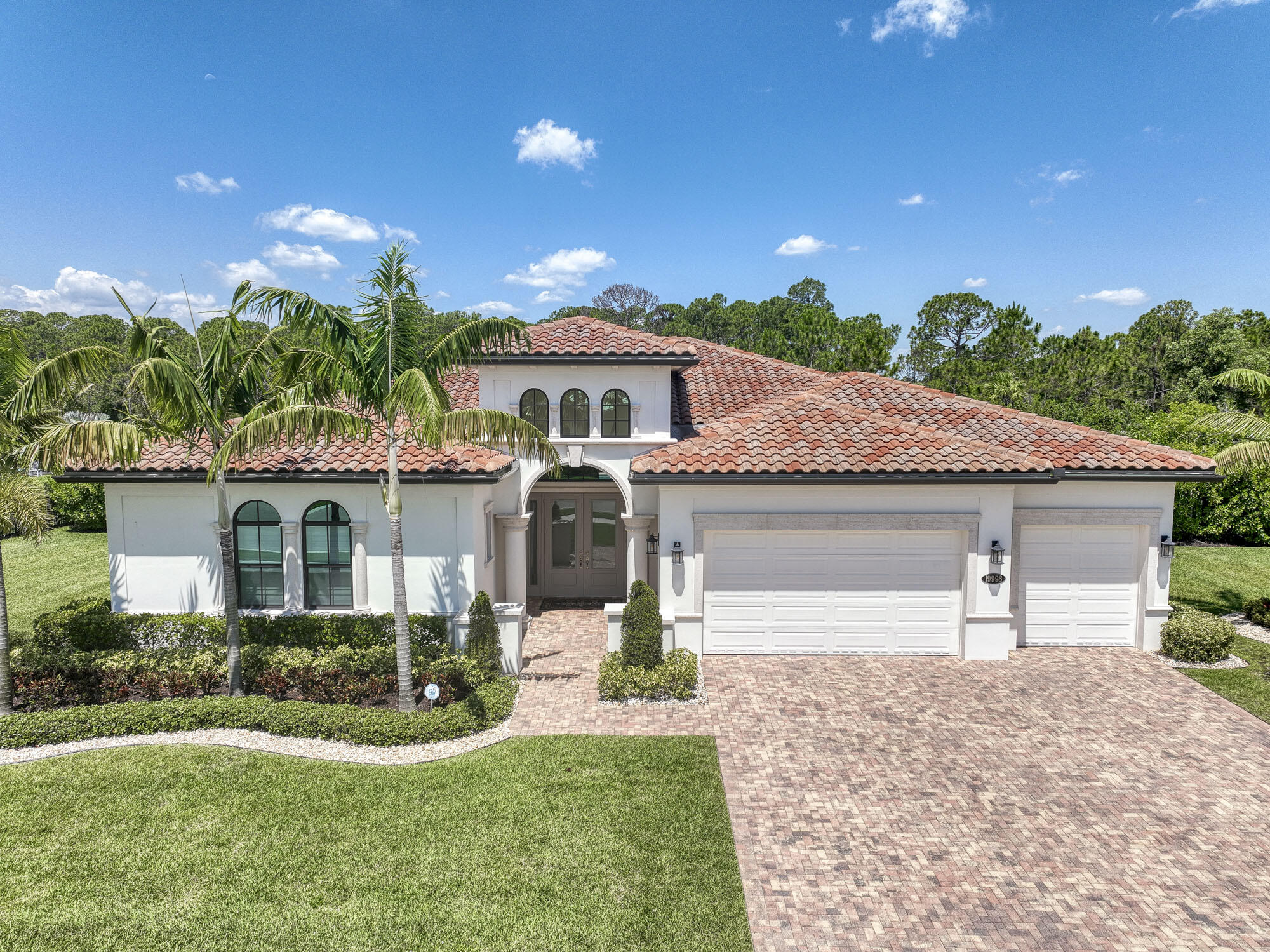 Stunning single-story home in the premier gated community of Prado.  This unique home welcomes you with a towering foyer that opens to an expansive great room.  The open layout draws your eyes directly to the resort pool and waterfall. The main living areas feature 12-14ft ceilings and dramatic designer lighting.  Reclaimed white oak wood look tile throughout home is both beautiful and easy to maintain.  The gourmet kitchen features an overside quartz island and walk-in pantry. The primary bedroom is an incredible 20 x 22 with spa bath and private direct access to lanai and pool.  The resort pool features a sun shelf, spa and waterfall with defined outdoor living and dining areas.  Select furnishings are available and negotiable.