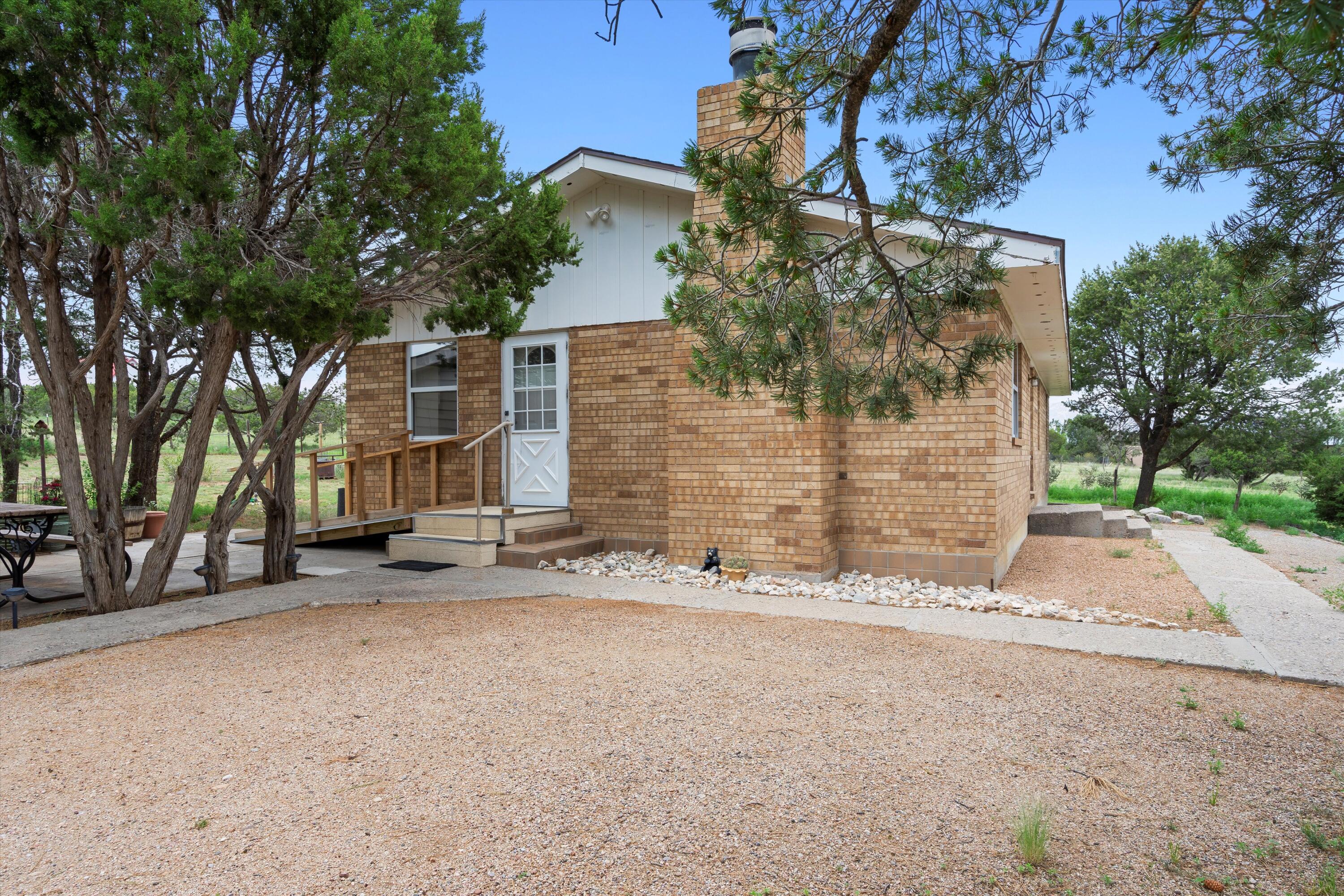 Discover this charming and cozy 3 bed, 2 bath home. Boasting a generous 1382 square feet of living space, this property offers ample room for comfortable living and entertaining. The detached garage provides secure parking, while the 700 square foot casita presents endless possibilities - whether it's a guest suite, home office, or a private retreat. This listing also include the additional 4.347 acres located at 3 Bachelor Trl. Don't miss this incredible opportunity to own a versatile and spacious property!