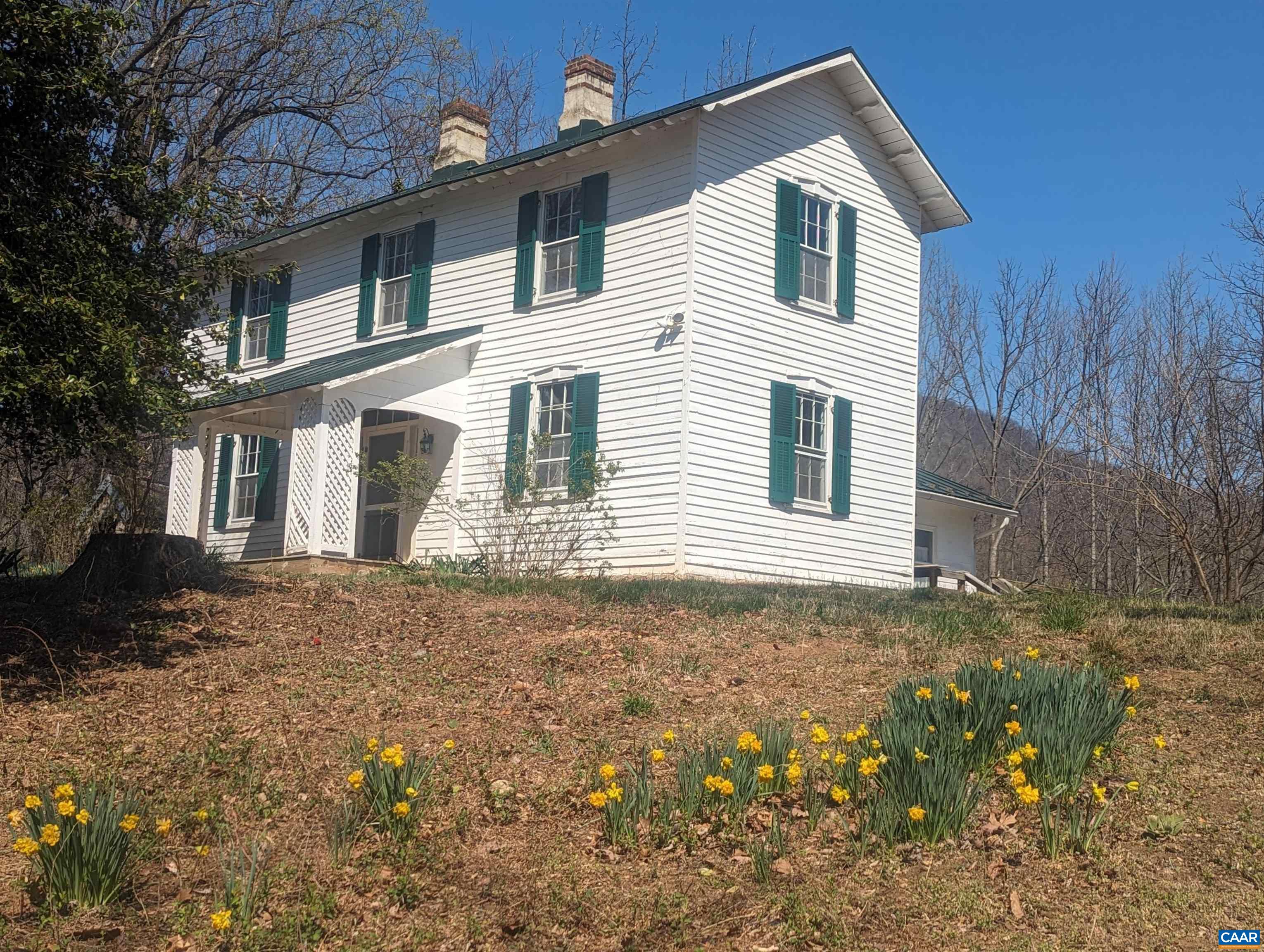 Very charming home built mid to late 1800's, retaining the original wavy glass windows, heart pine floors and clapboard siding. Stunning views of the Blue Ridge Mountains in WAlbe,  the sunrises and sunsets are spectacular. The 9.44 acres has Stony Run at the rear and a spring that historically provided water to numerous homes in the area via a ram pump and stored water in a concrete cistern that is still on the property.  There is an old partially log structure in disrepair and we ask that no one goes into the structure because of it's condition. It would be a great restoration project.  The adjoining homes in the area are of very high quality. There is a possibility that this land could be divided and two more building sites developed if all the county approvals are met. The metal roof was replaced in 2013 and the forced air furnace around 2013. An addition in 2004 added a large mud room, full bath, laundry area, side deck. The entire interior has been painted and plaster repaired. None of the fireplaces are in working order. The chimney tops were re-pointed in 2013 prior to the new roof going on. The home, all appliances & outside structures are sold in "as is" condition. The home needs continued restoration but worth it.