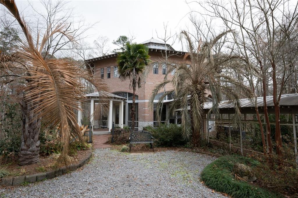 Nestled within the prestigious River Ranch subdivision, this unparalleled estate offers a rare opportunity to own a one-of-a-kind sanctuary. The main residence, a stunning octagon-shaped masterpiece, and a charming 2,000 sq. ft. guest house rest on 11 acres of pristine, secluded woodland, ensuring absolute privacy and tranquility. Designed by a renowned landscape architect, the property is a true work of art, featuring sweeping views of the lush Louisiana swamp and an abundance of native plants, majestic oak, pine, and cypress trees. This exceptional estate also boasts a captivating art cottage, perfectly positioned to take in the rolling topography and breathtaking surroundings. With its harmonious blend of nature and luxury, this property offers an escape into unparalleled serenity—where every detail is thoughtfully curated to create an experience unlike any other. This unique property must be sold together, offering a rare opportunity to own not just a home, but an extraordinary retreat where the beauty of nature and the elegance of design come together in perfect harmony. Don’t miss your chance to experience this remarkable, once-in-a-lifetime opportunity to own a piece of paradise.