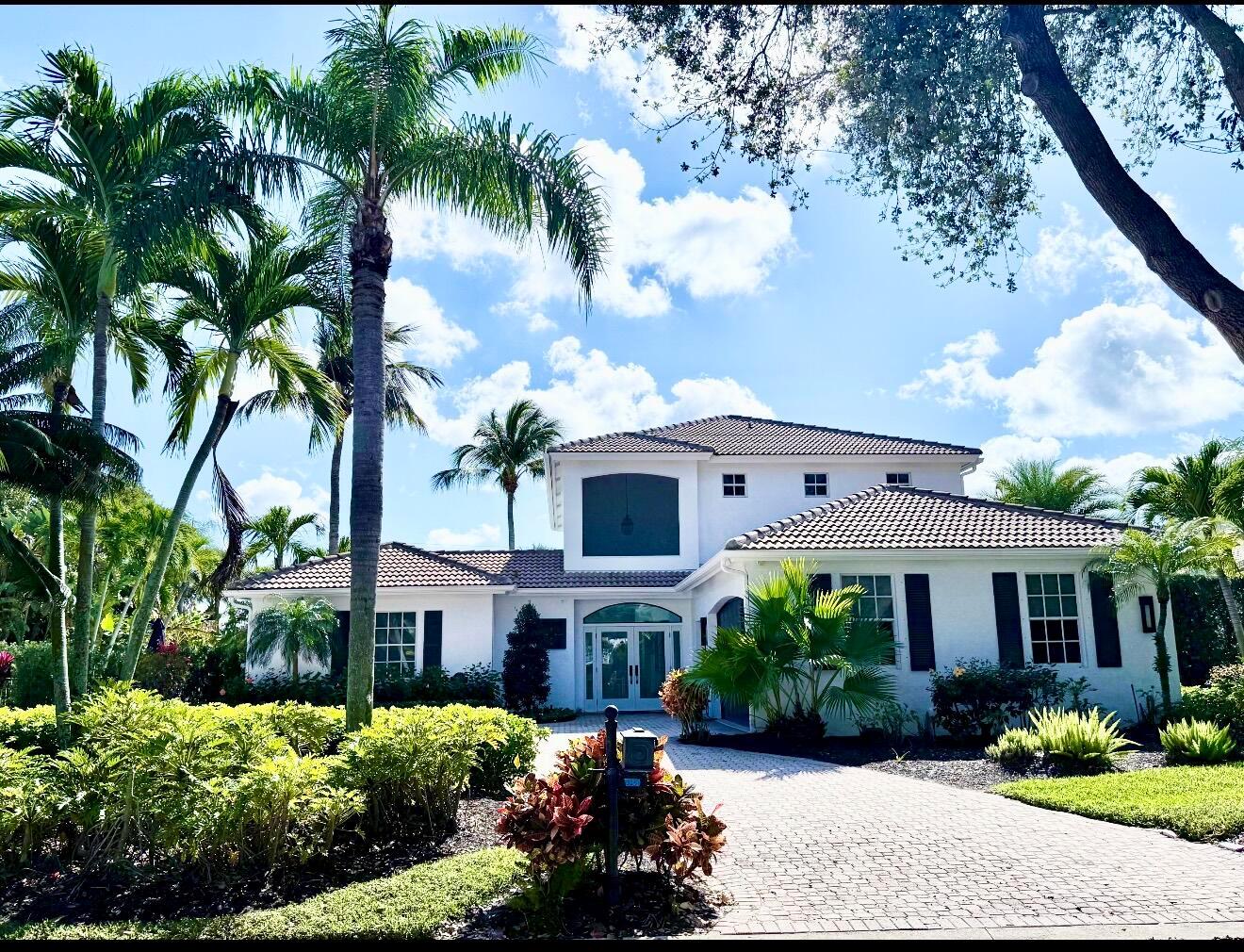 DOUBLE LOT! Rarely offered Admirals Cove home on 1/2 acre, lushly landscaped PRIVATE location.Huge resort style pool/spa w/southern exposure. Summer kitchen. Expansive garden areas. Newly upgraded home boasts 4 large bedrooms ensuite, large loft, balcony and including 1 bedroom guest house w/full bath. Open great room floorplan w/volume ceiling. New blonde wood floors thruout. Open kitchen w/stainless steel appliances, wood cabinetry, quartz countertops, pantry.  Breakfast area. New ACs, New pool heater. Contemporary glass front door leads to large screened enclosed furnished patio. New wrap around bar w/ lighted quartz countertop. Designer deco custom lighting. First floor primary suite wing w/2 large walk in custom closets, office, sitting area, dressing area. Quick Closing Available