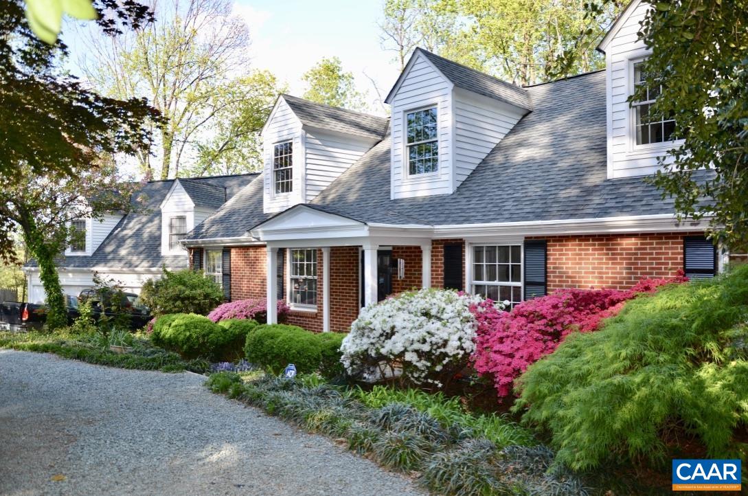 Tucked away near UVA and Barracks Road shopping, discover a private in-town compound offering flexible living on a sprawling 0.92-acre lot. This gracious classic estate, complete with a separate guest house or home office, allows you to enjoy nature right at home. Designed for entertaining, both inside and outside on three decks. The property features multiple primary suites, kitchens, and bathrooms. With owner financing available for half the purchase price, you can generate significant income from one or more AirBnBs or rentals while residing in the main house.