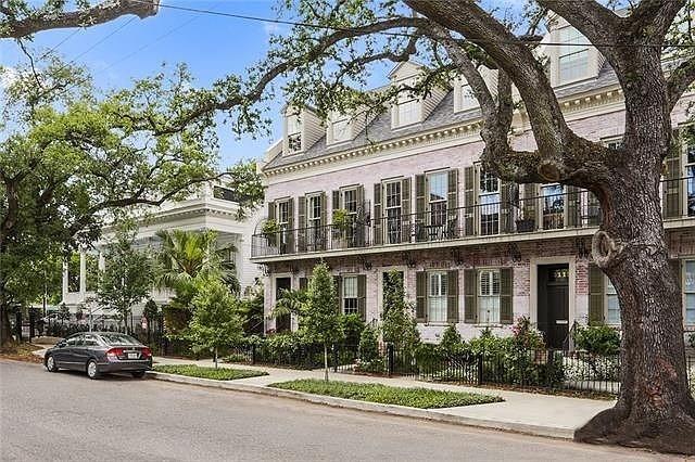 Stunning 3-story brick townhome nestled in the heart of the Lower Garden District, built in 2015 offers open-concept living area with abundant natural light.  3-bedrooms (2 en-suite), primary bedroom features soaking tub & walk-in shower, 3.5 superior bathrooms, large gourmet kitchen accented with oversized windows, high-end finishes and stainless steel JennAir appliances, induction cooktop, wine cooler and quartz countertops. Soaring 10’-10.5’ ceilings with crown molding compliment the pine/stone floors throughout offering the perfect blend of modern elegance and historic charm.
Relax on the inviting landscaped front brick patio and charming balcony overlooking Prytania Street…the property also boasts 2 central air/heat systems, 1-car garage plus an additional assigned parking spot in the rear fenced lot…this is a prime location near restaurants, shops, and vibrant city life, located one block from St. Charles Avenue with its historic street car line. Note $1,600 HOA fee is annual.