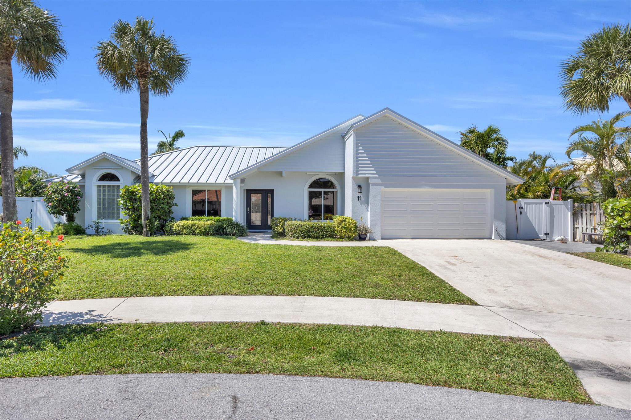 Located on a quiet cul-de-sac in the desirable Tequesta Pines neighborhood, this 3-bedroom, 2-bathroom CBS home offers comfort, style, and smart upgrades throughout. Enjoy peace of mind with a brand-new metal roof (2024) and hurricane impact windows and sliders (2025), with a few remaining openings protected by panel shutters, ideal for both safety and receiving maximum insurance discounts.Step inside to find high ceilings, spacious living areas, and a split-bedroom floor plan perfect for family living or hosting guests. The private saltwater pool creates a relaxing outdoor retreat, ideal for enjoying the year-round South Florida sunshine.Eco-friendly features include solar panels and an EV charger in the garage, adding value and efficiency.
