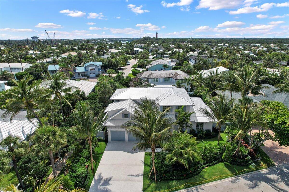 Experience the pinnacle of coastal luxury in this brand-new custom home, perfectly positioned in the exclusive Jupiter Inlet Colony on Jupiter Island. This prime interior location--just one home away from the ocean--offers effortless access to the beach via a scenic beach path.  Designed for both sophistication and comfort, this masterpiece boasts an open-concept layout with meticulous attention to detail. The first-floor primary suite is a true sanctuary, complete with two walk-in closets and an elegant vanity station. The chef's kitchen is an entertainer's dream, outfitted with Downsview cabinetry, Sub-Zero & Wolf appliances, a walk-in pantry, and a built-in Miele coffee system. A separate bar area with a Sub-Zero wine refrigerator ensures seamless hosting. Luxury finishes throughout create a timeless aesthetic, while an expansive bonus room provides views of the beach path. Step outside to your private tropical oasis, where a heated saltwater pool, spa, and summer kitchen await. The covered patio, featuring hidden motorized screens, offers a serene retreat for relaxation. Rinse off in the outdoor shower after a day at the beach, then unwind in the tranquil pool and spa, letting the soothing sounds from the ocean just steps from your front door wash over you.
Nestled within Jupiter Inlet Colony, a prestigious enclave of just 240 residences, this home offers private beach access, a dedicated police department, and close proximity to the Jupiter Inlet Beach Club, JIBC Marina, and Cato's Bridge. Take in breathtaking moonlight walks along the shore, enjoy world-class dining just 5 minutes away, and arrive at Palm Beach International Airport in approximately 25 minutes.
A rare opportunity to own one of Jupiter Inlet Colony's finest new construction residences. Don't miss your chance to live the ultimate coastal lifestyle! Finishing touches are still being done to this home.  Expected completion within 3 weeks.  Professional photos to follow!