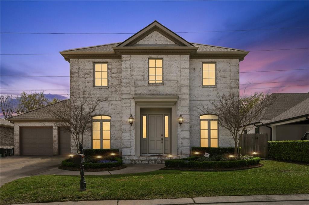 Welcome to Metairie Club Estates—where luxury living blends seamlessly with everyday convenience. This gated subdivision is nestled next to Metairie Country Club’s Golf Course with easy access via Airline Drive - just minutes from the heart of Old Metairie and New Orleans. This beautiful two-story brick residence offers a light-filled open layout. You’ll enter and find rich, hardwood floors and an impressive iron staircase. The chef’s kitchen is equipped with premium stainless steel appliances including an ice maker, and a sleek wet bar with a wine fridge and is open to the living room where you’ll find an elegant fireplace, a wet bar and handmade wooden shelves.Thoughtfully designed for entertaining, this home features both a casual breakfast area, a formal dining room and kitchen bar.  With four spacious bedrooms upstairs and an office or possible fifth bedroom downstairs, three and a half baths, a private office, two individual single-car garages, and a full-home generator, this property delivers comfort and reliability in every season. The backyard features low maintenance turf and a cozy patio - ideal for morning coffee or casual alfresco dining.