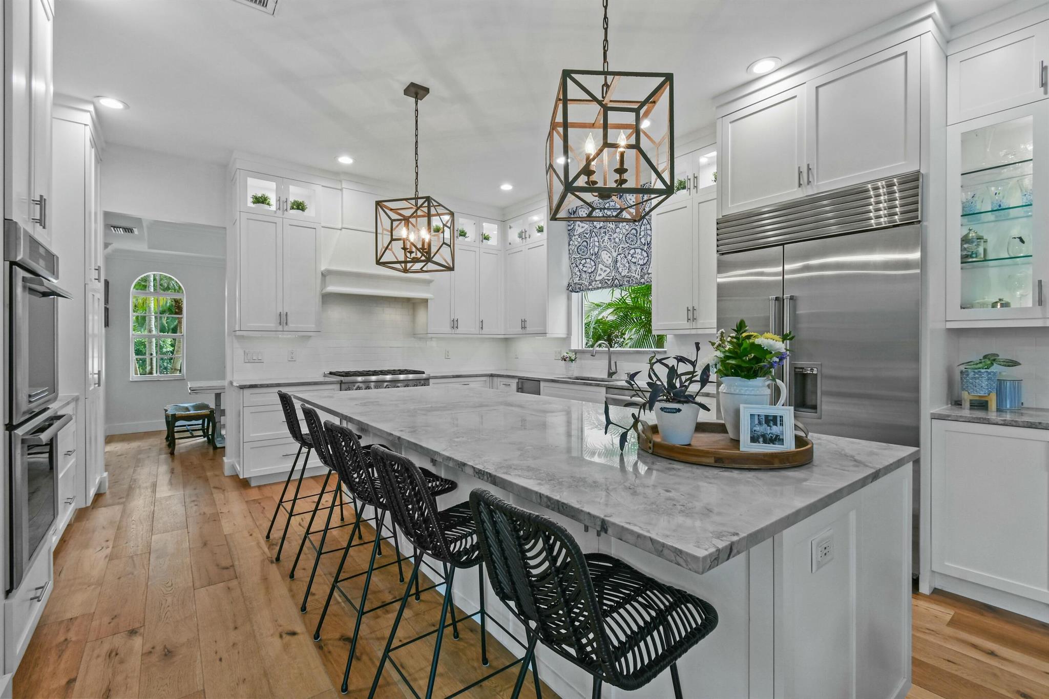 .Welcome to Valencia, the only custom neighborhood in Abacoa. This completely redone five-bedroom, five-bathroom home, with an in-law suite and loft space, offers luxurious living in one of Jupiter's most desirable communities. A full bedroom is conveniently located on the main floor for an office or guests. The interior features all-new, beautiful, wide-plank wood floors, smooth-finished walls, and high-end finishes in every room.The brand-new chef's kitchen is a dream with an oversized island with quartzite countertops, a Sub-Zero refrigerator, a Thermador gas range and oven, another Thermador double oven, ice maker and wine fridge. Other updates include all-new solid wood doors, crown molding, six-inch baseboards, all-new lighting, custom metal railings, impact windows, and doors. Don't forget the private in-law suite with a separate entrance, efficiency kitchen, living area, full bath, large walk-in closet, and private bedroom.
The outdoor space is made for entertaining, with resurfaced travertine patios (front and back), a resurfaced pool with new tile, new equipment, and a heating system. There is also an outdoor built-in BBQ and a 3-car garage. The exterior has been freshly painted, and this home is truly move-in ready.

This prime  Jupiter location is near top-rated A+ schools, including Jupiter High School, with highly regarded academic and specialty programs. Just minutes to shopping, dining, medical centers, golf, educational facilities, and some of Florida's most beautiful beaches.
If you're looking for the best of Jupiter, Valencia at Abacoa has it all.

;